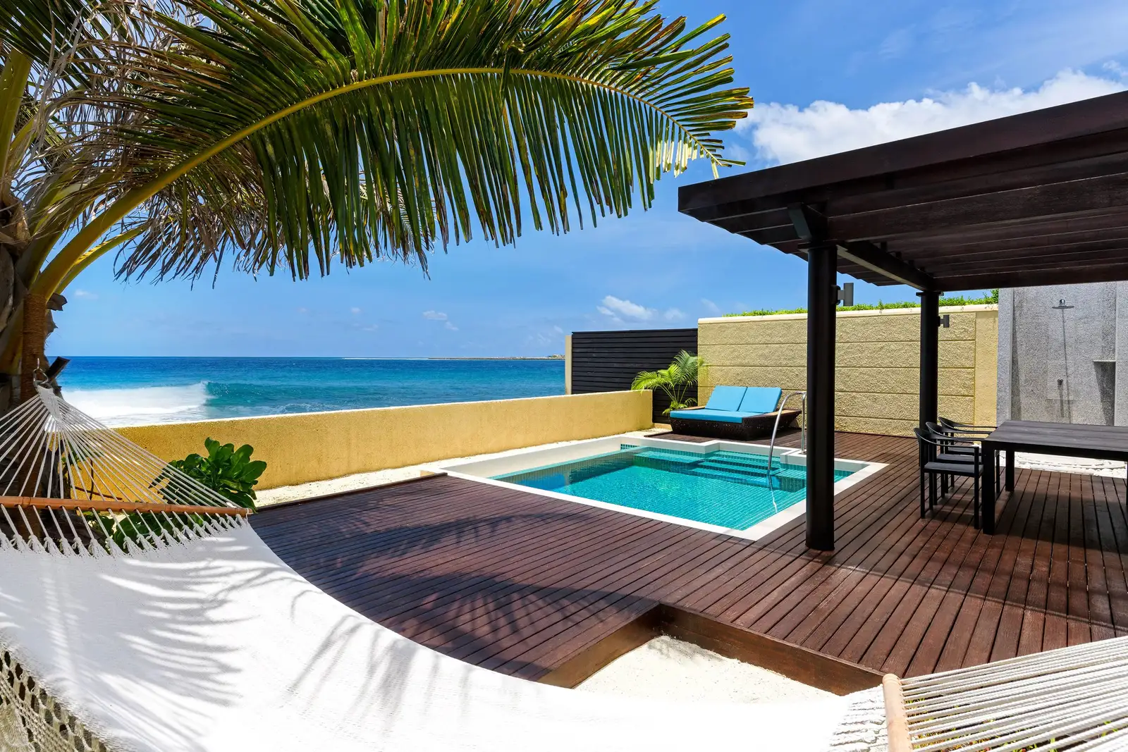 An Ocean Pool Villa’s deck, the hammock, the pool and the sea