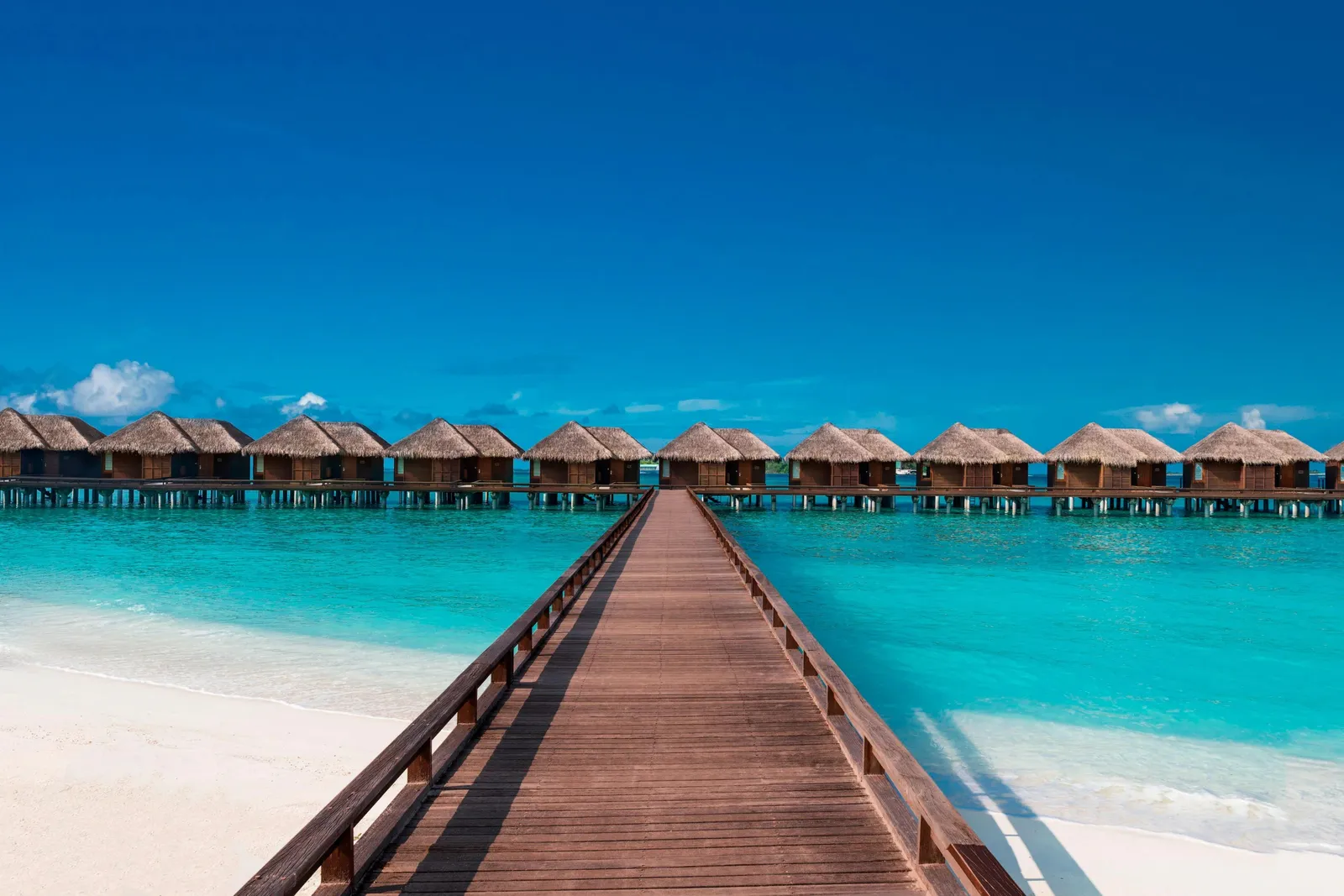 The wooden walkway out to the row of Overwater Villas