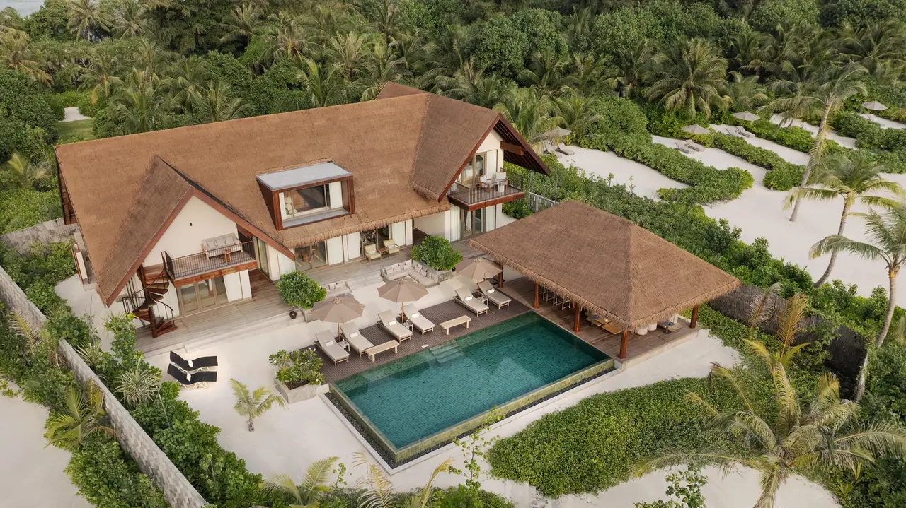 The Three Bedroom Beach Reserve from above: the 2-storey villa, the pool and loungers among the plants