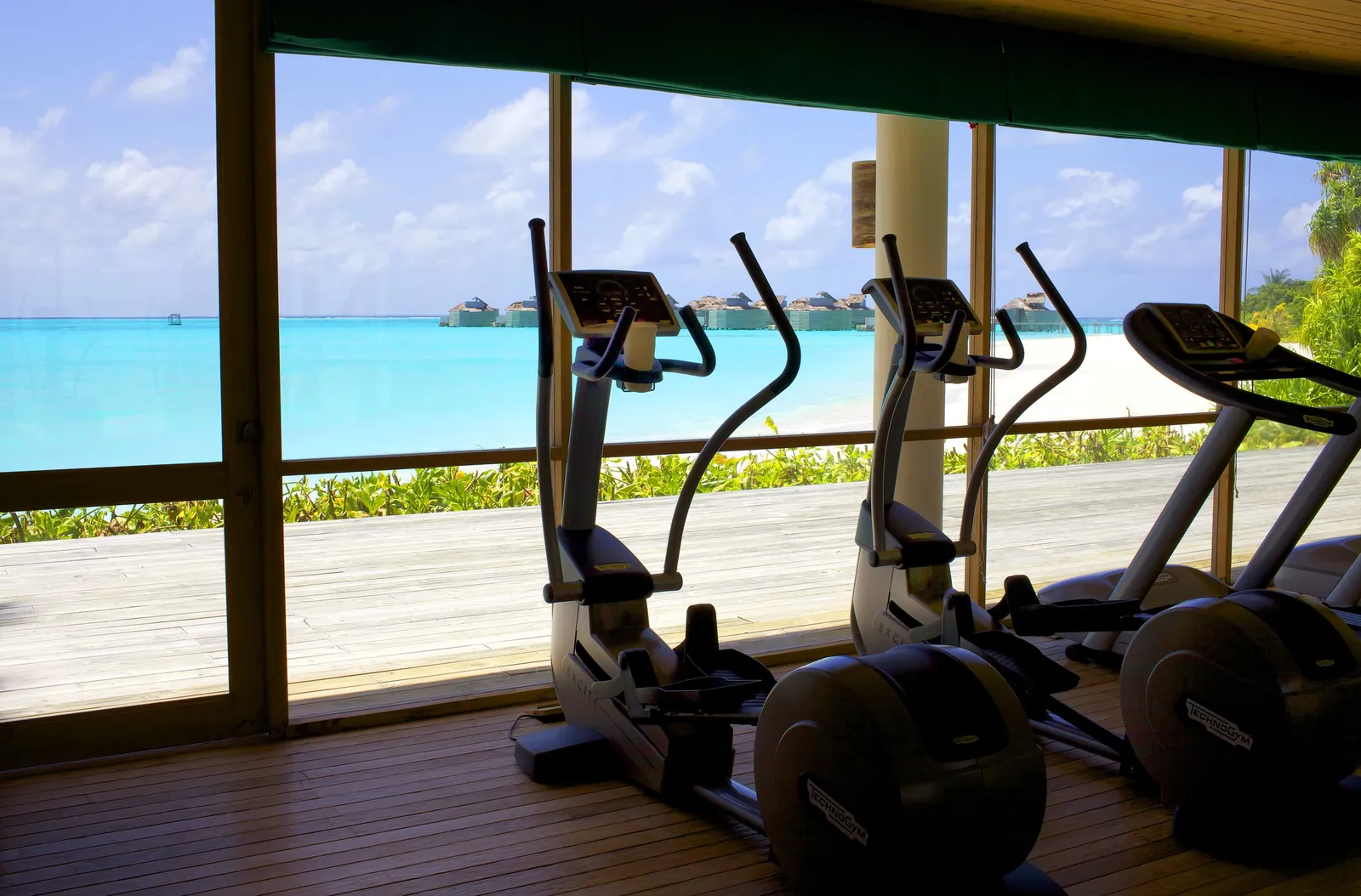 The sea-facing gym, elliptical trainers before the windows
