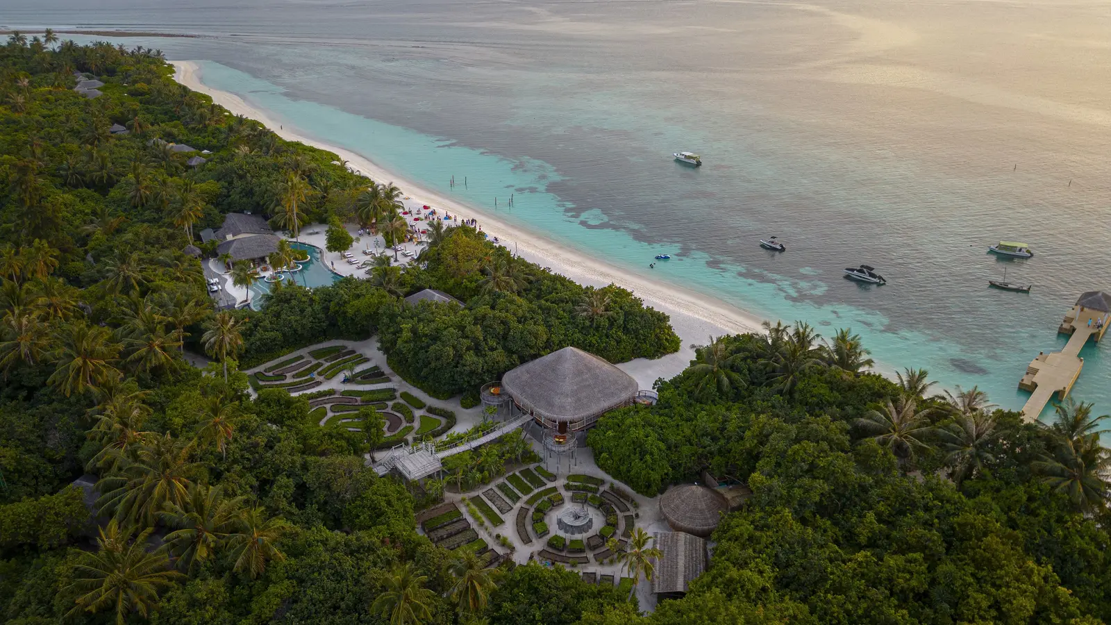 Laamu’s beach at sunset, with the garden and Leaf among the palms