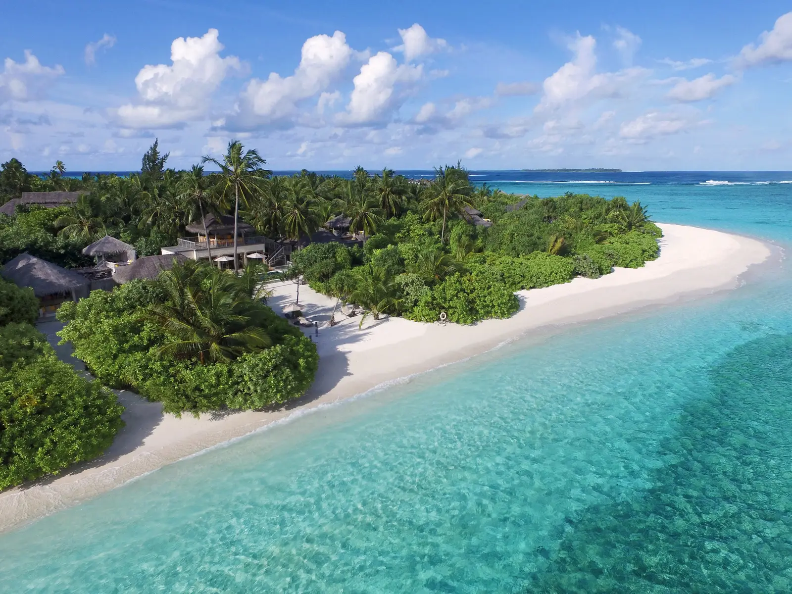 The Two-Bedroom Ocean Beach Villa with Pool from the air, at the tip of the island