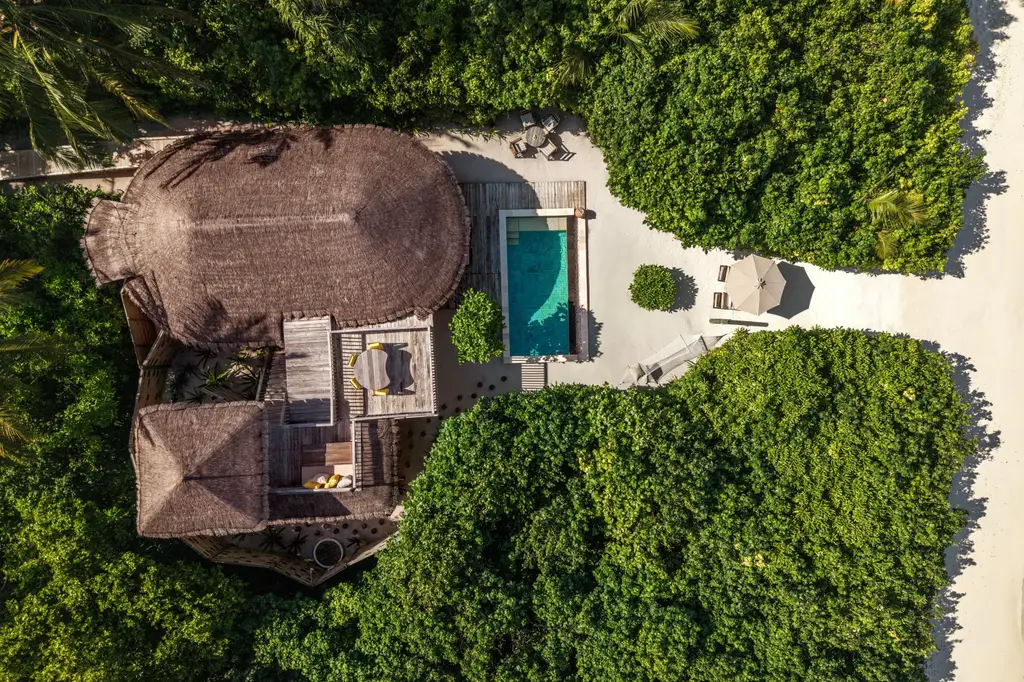 A Family Lagoon Beach Villa with Pool from above, in the beach woodland