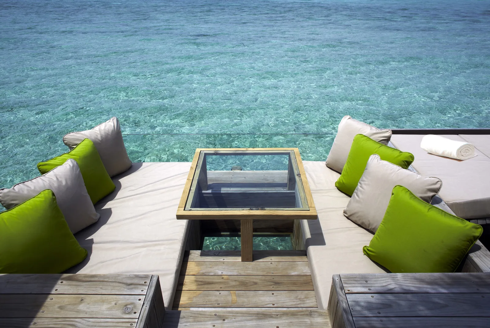 A Laamu Water Villa’s deck, with its sunken glass bathtub
