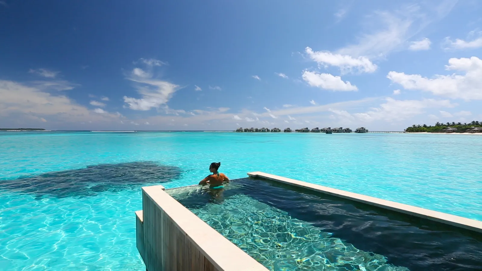 The deck pool of an Ocean Water Villa with Pool, facing the ocean