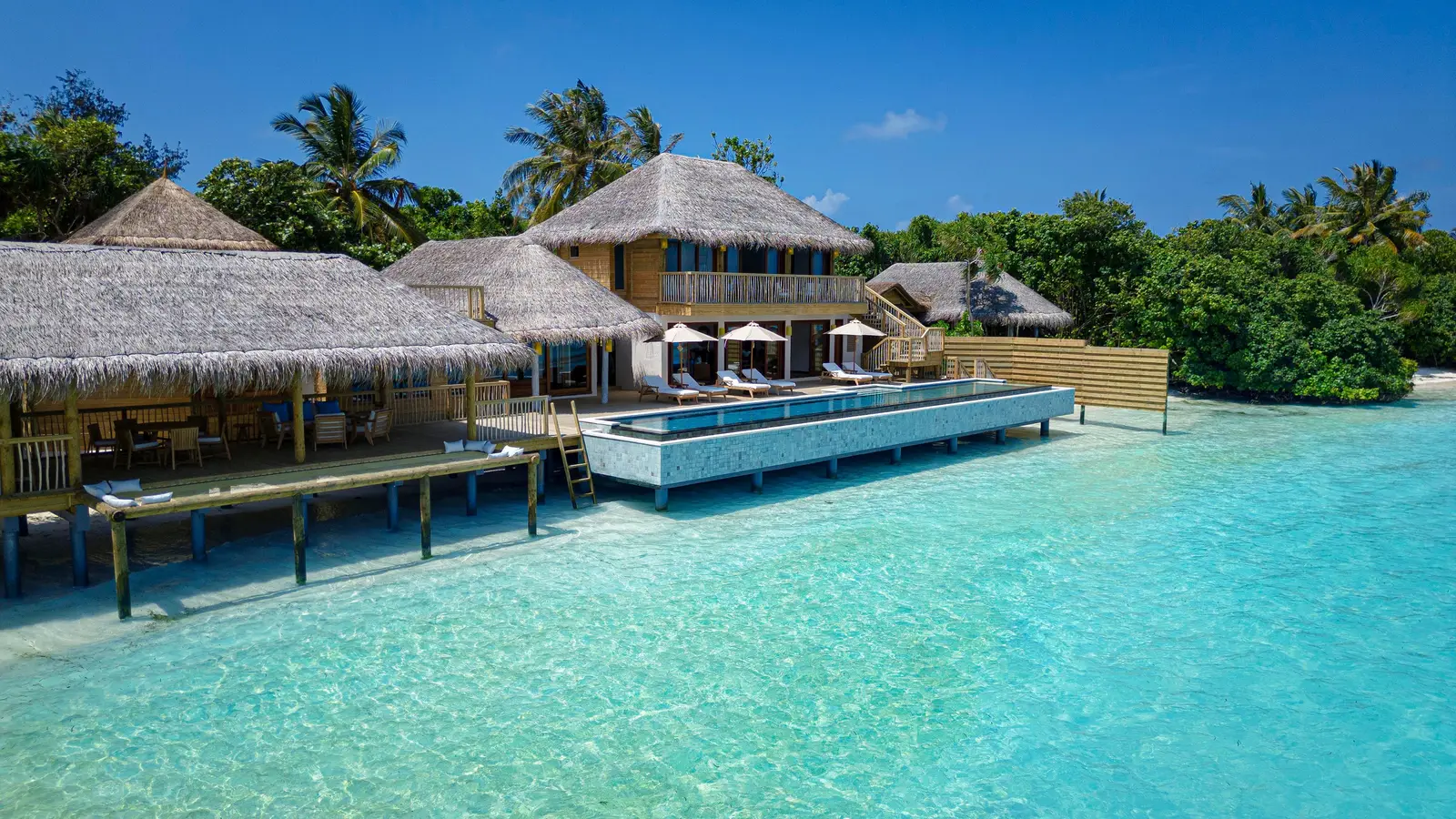 The Retreat from the lagoon: the 2-storey house and its pool by the sea