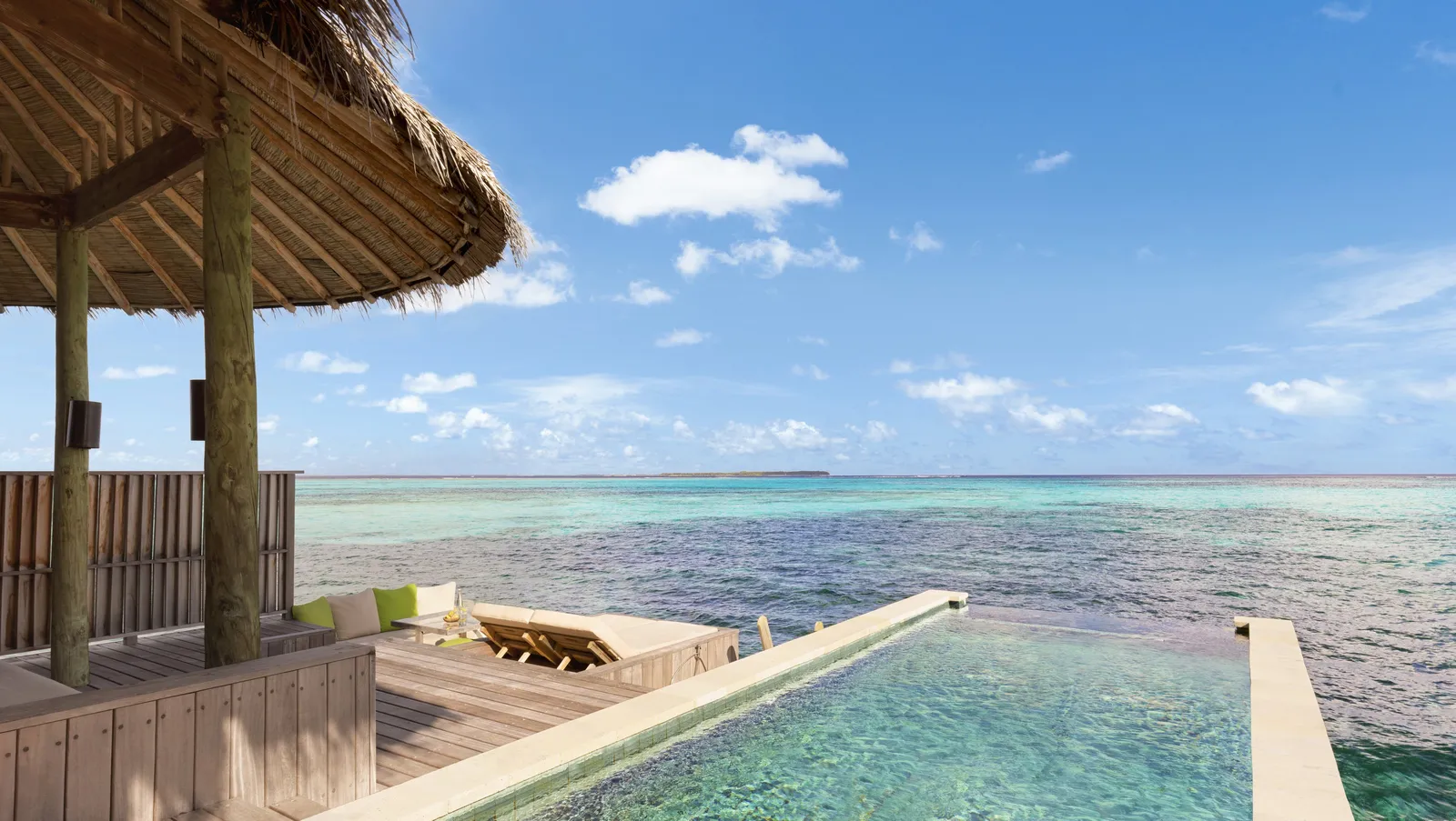 A Sunset Laamu Water Villa with Pool’s terrace, its pool above the sea