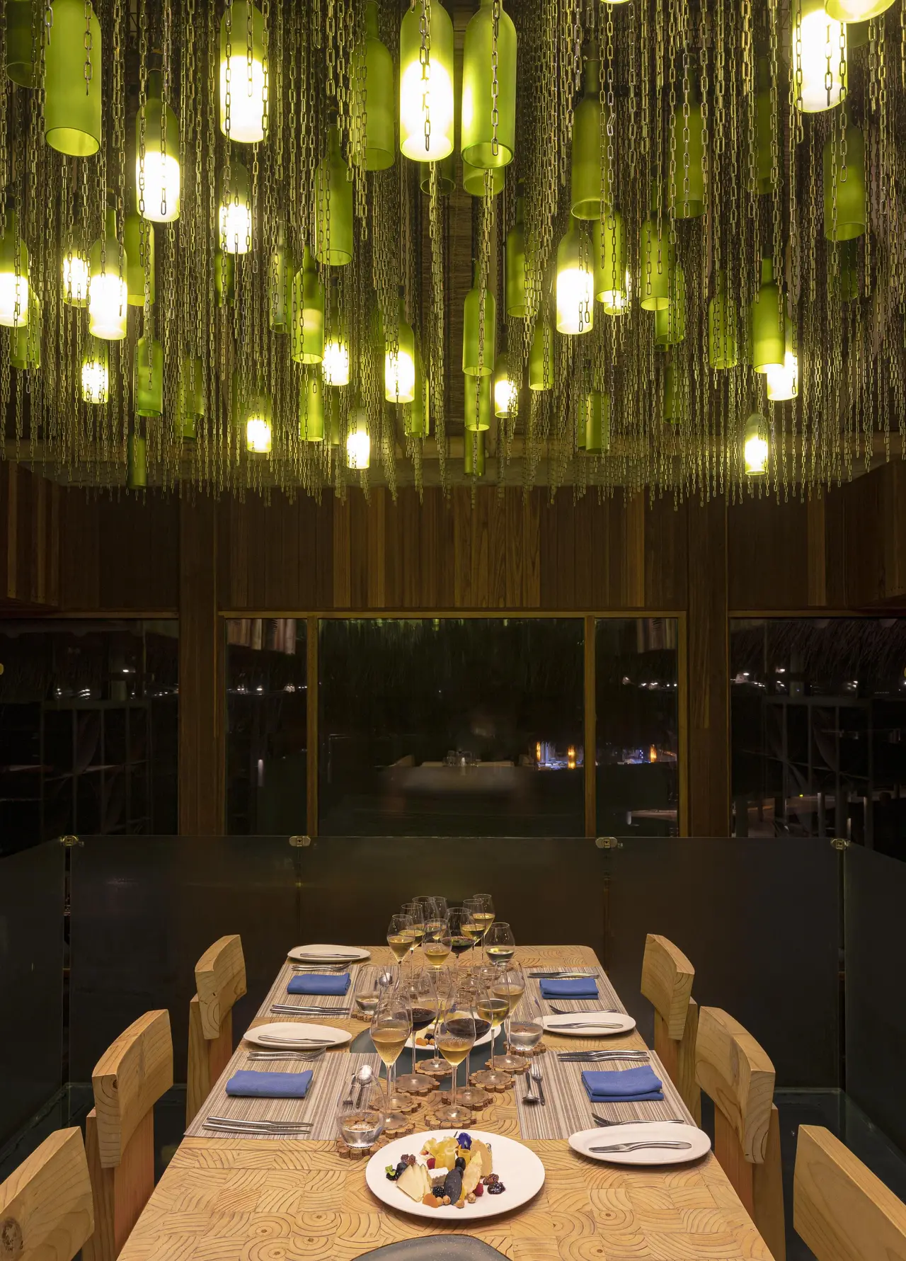 The table in the Altitude cellar, beneath a ceiling of glass bottles