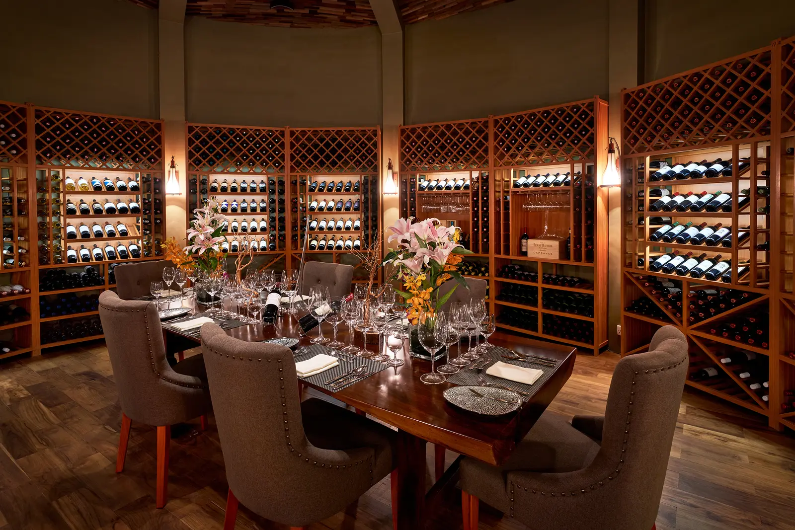 Barrique’s table in the cellar, among the racks of bottles