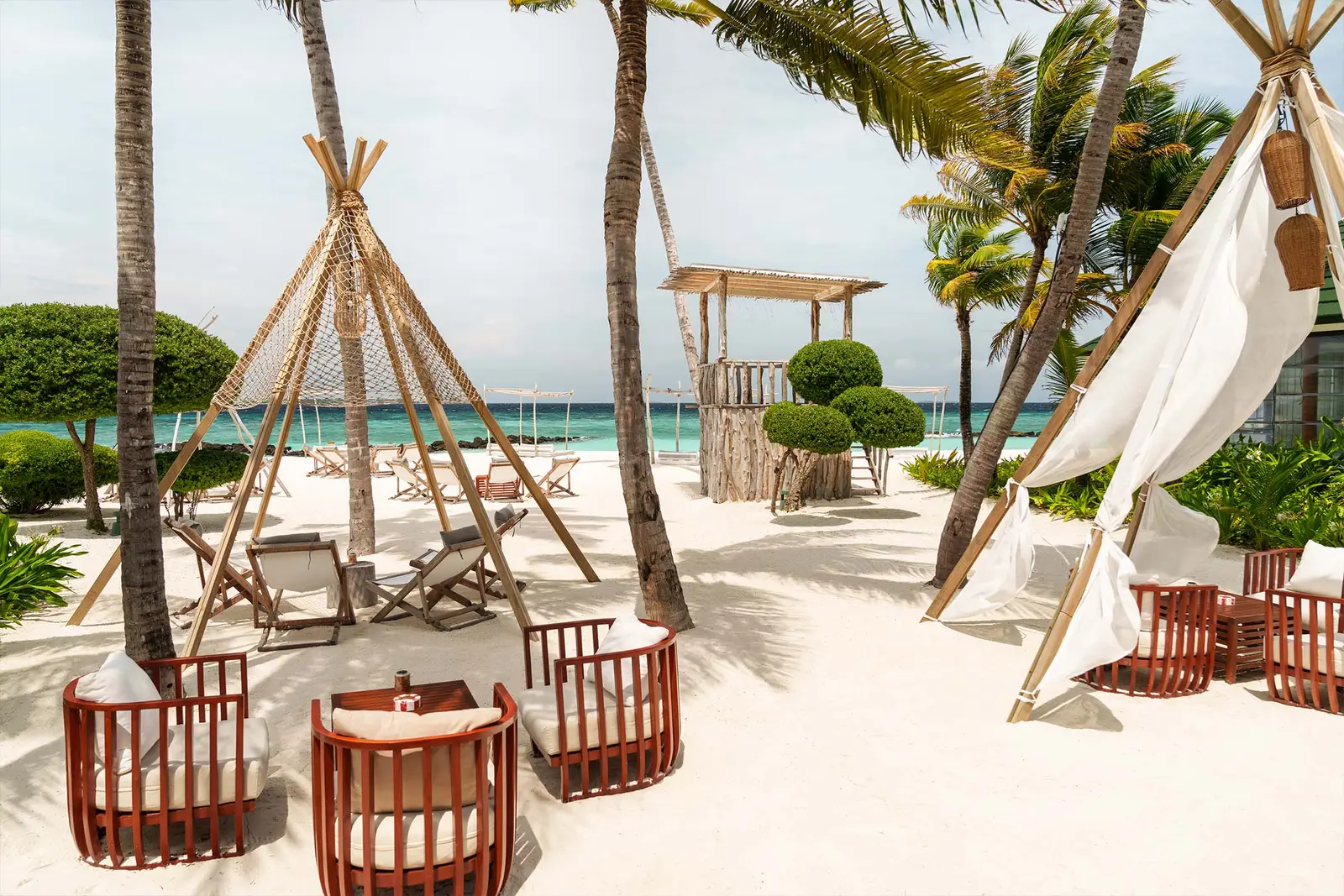 Mint, the adults-only bar, with white tepees and armchairs on the sand
