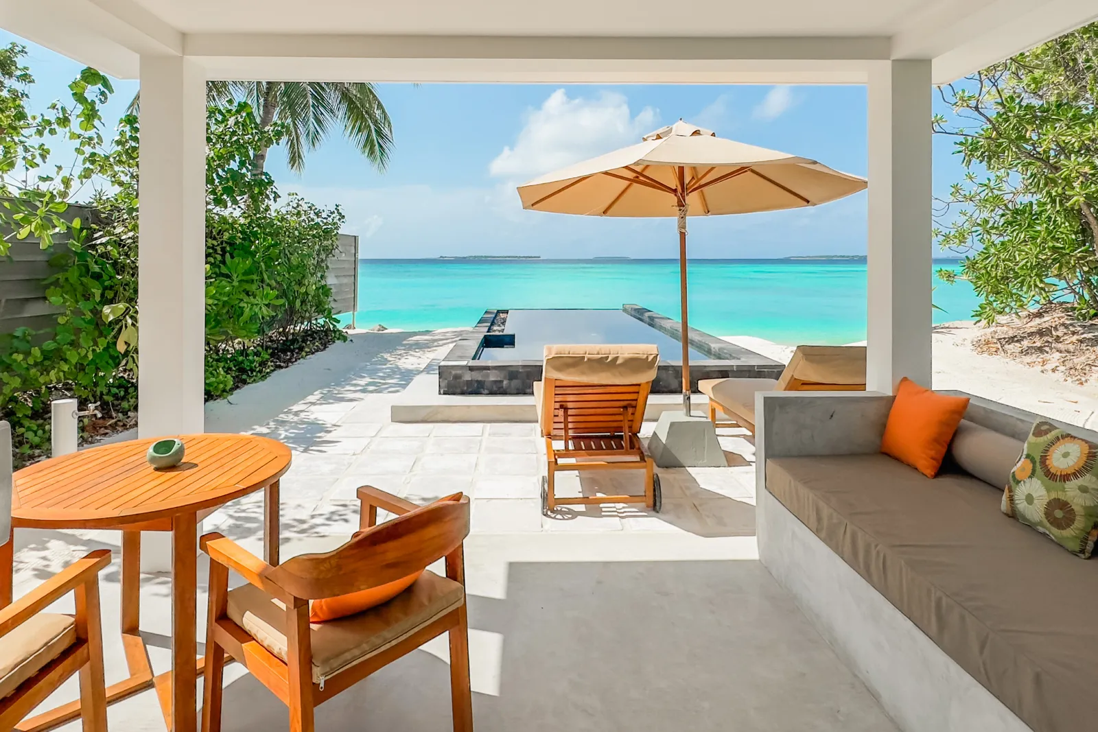 A Beach Suite’s terrace, its table and pool facing the sea