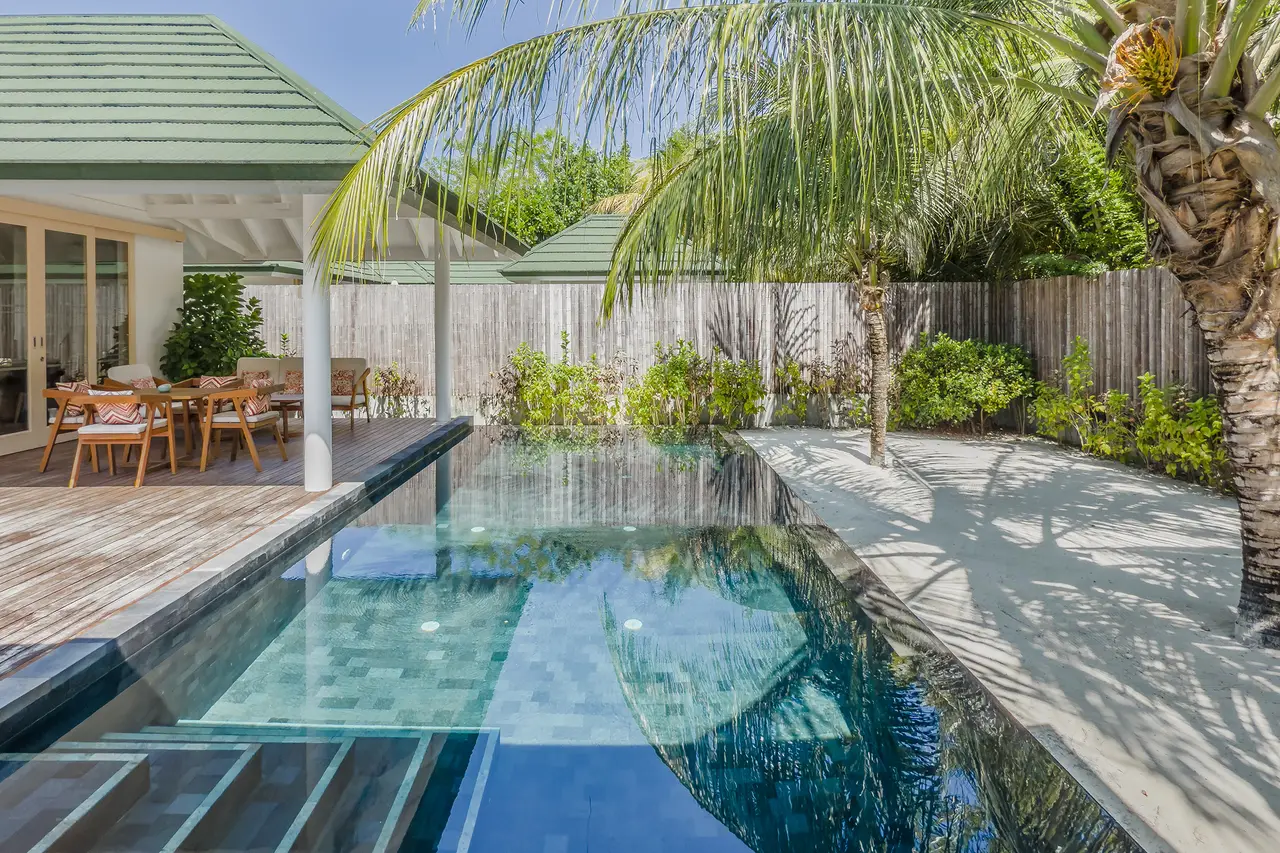 The Grand Beach Residence courtyard, its long pool and patio