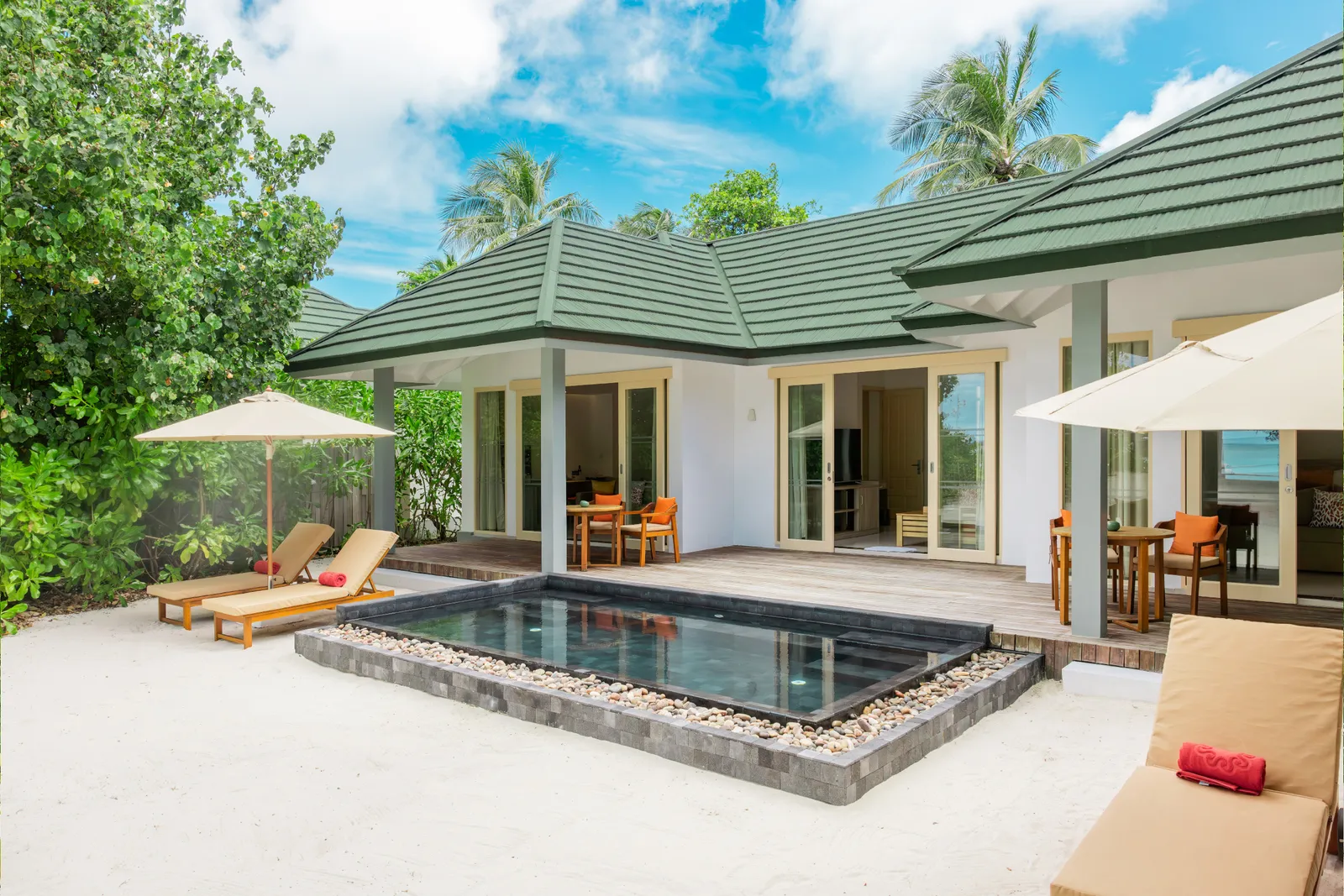 A Two Bedroom Pool Beach Villa, its pool and the house on the beach