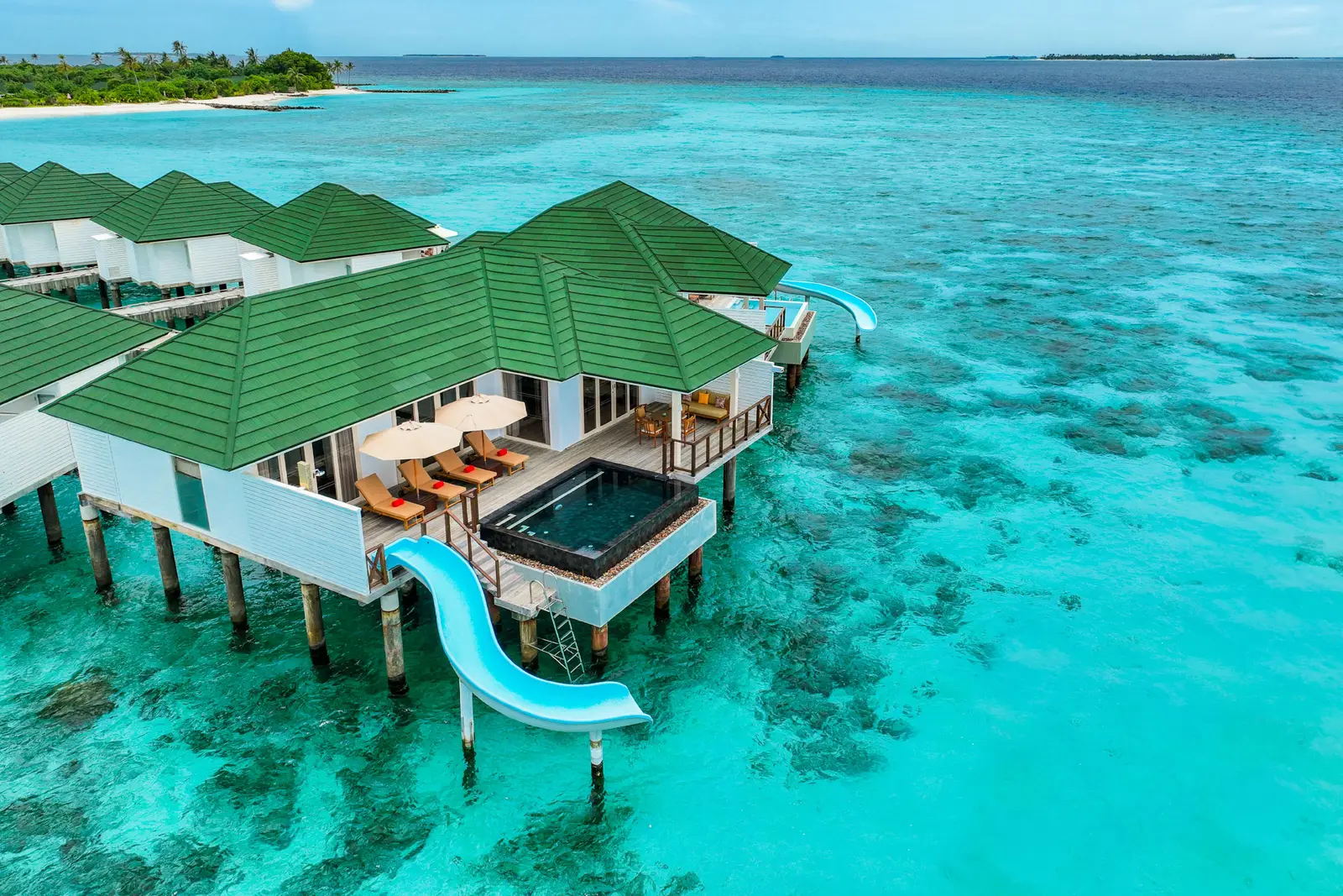 The Water Pavilion over the water, its pool and blue slide