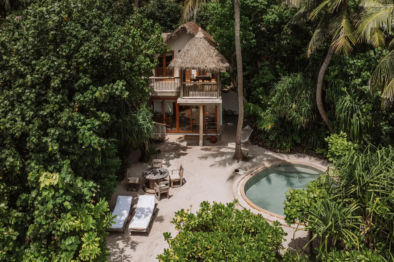 2 Bedroom Crusoe with Pool from above: the house and its round pool in the jungle