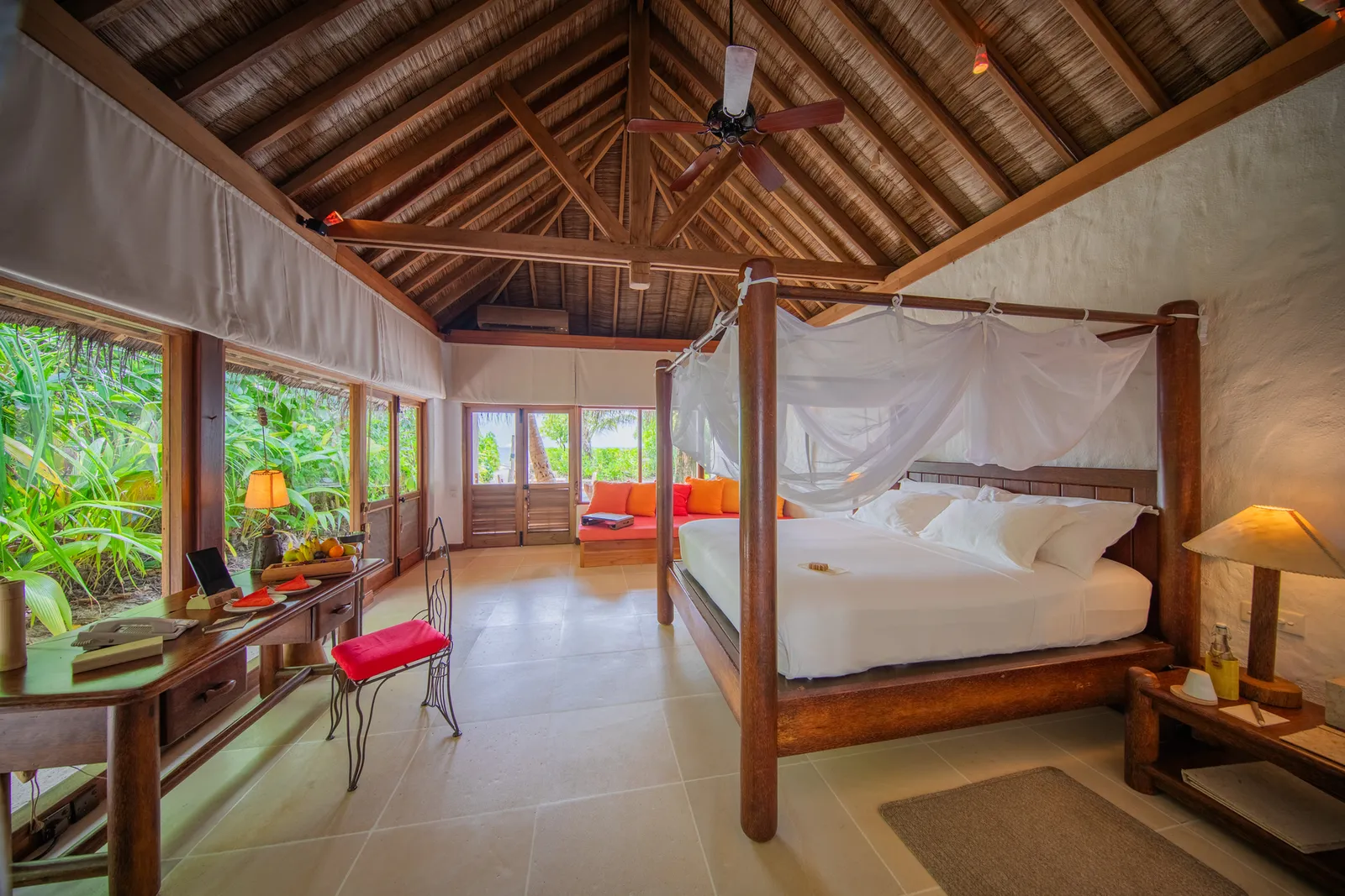 2 Bedroom Soneva Fushi Villa: the bedroom, a four-poster under the timber roof