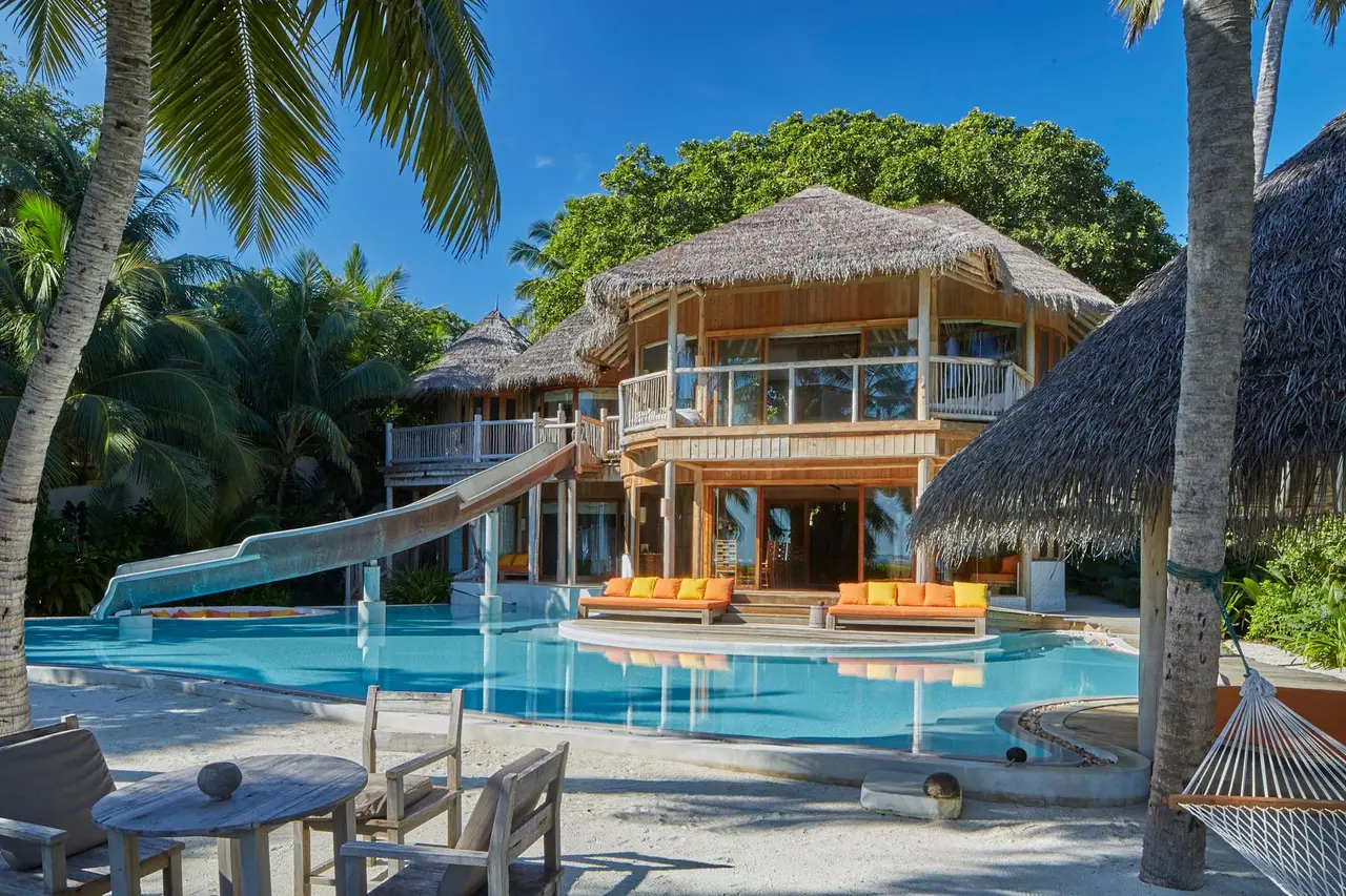 A 4-bedroom Residence, its slide running down into the pool