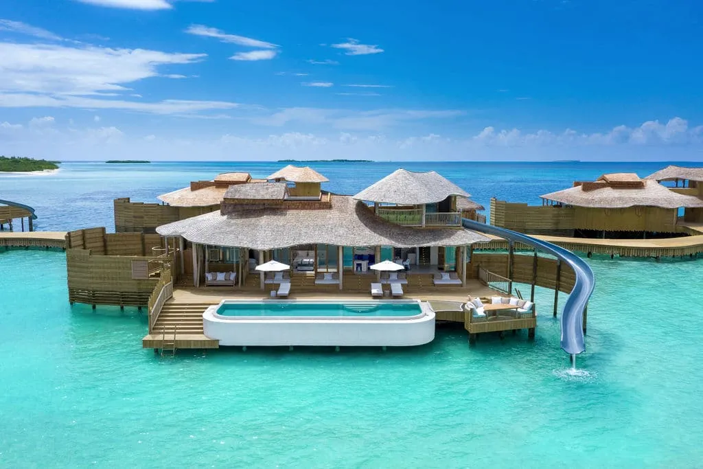 The 1 Bedroom Water Reserve: the villa over the water with its pool and the slide into the lagoon