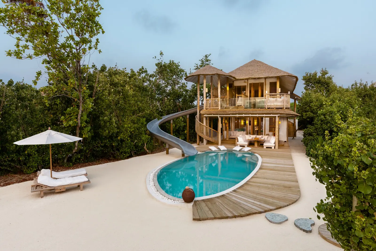 The 2 Bedroom Island Retreat: the oval pool and the slide from the upper floor