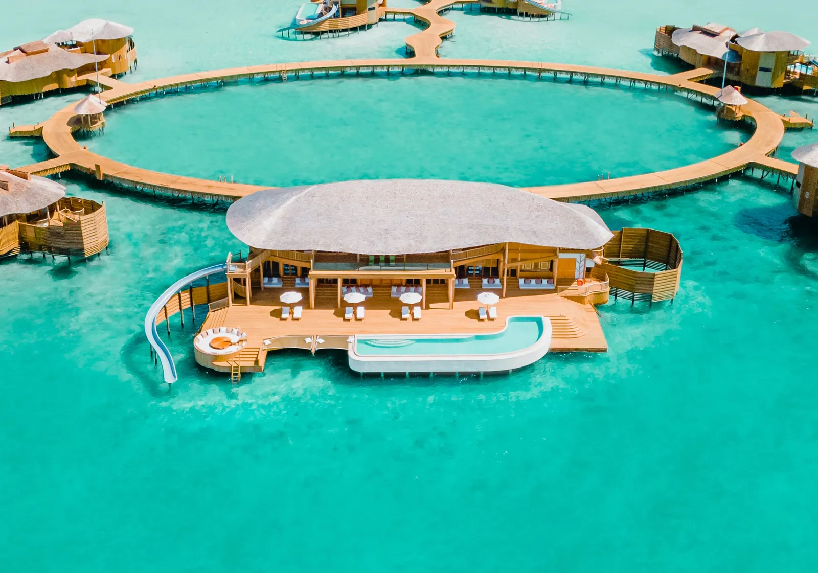 Villa 105 from the air: a ring of walkway around the villa and its pool