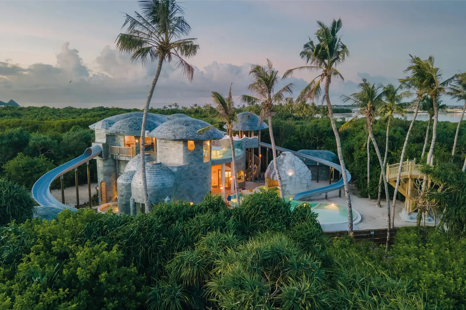 The Den among the palms: timber domes, a slide and the children’s pool
