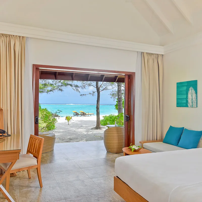 A king bedroom and terrace towards the beach.