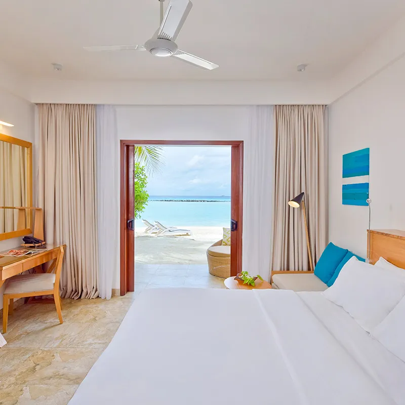The ground-floor bedroom and veranda towards the beach.