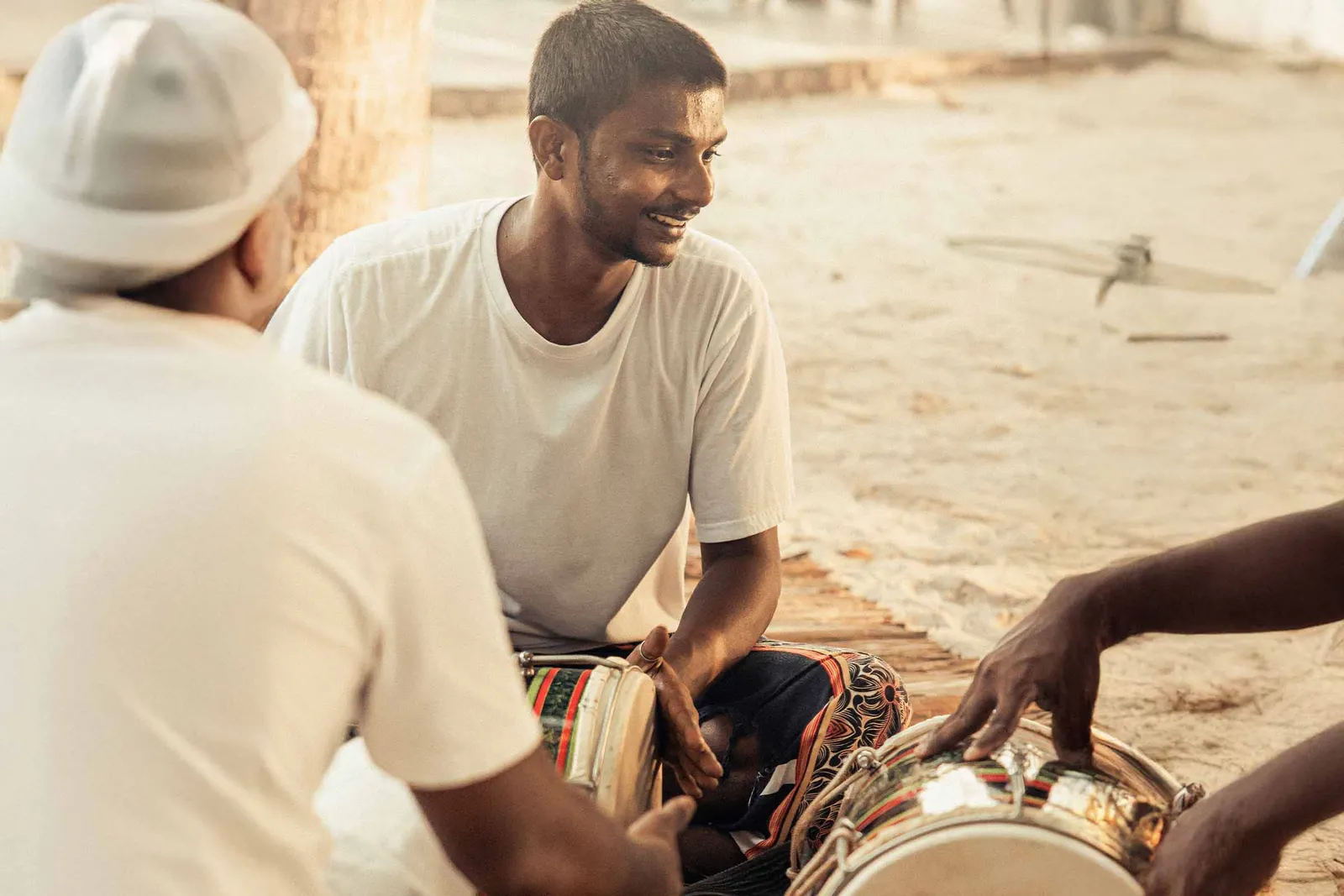 Bodu beru drums played on the sand.