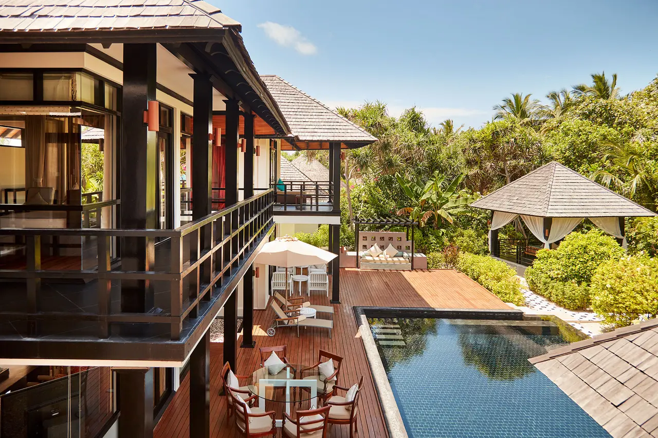 The Celebrity Retreat: the 2-storey villa with its timber balcony, the pool and the garden.