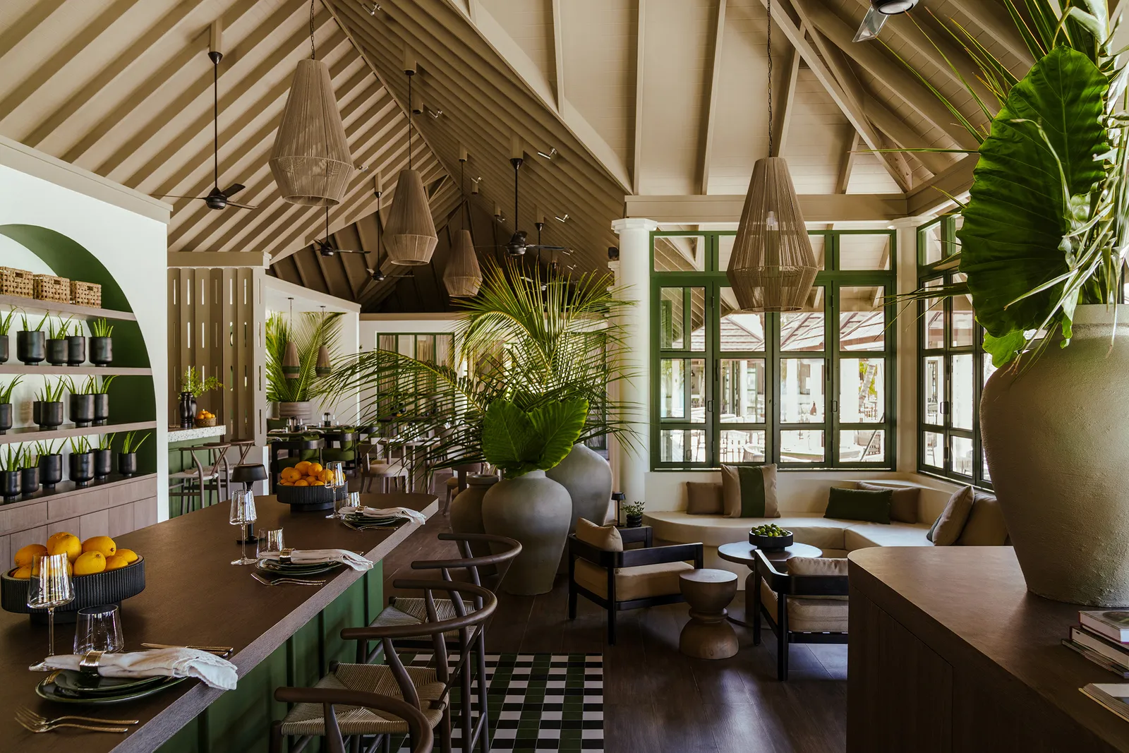 Milano’s dining room, the counter and tables among the plants