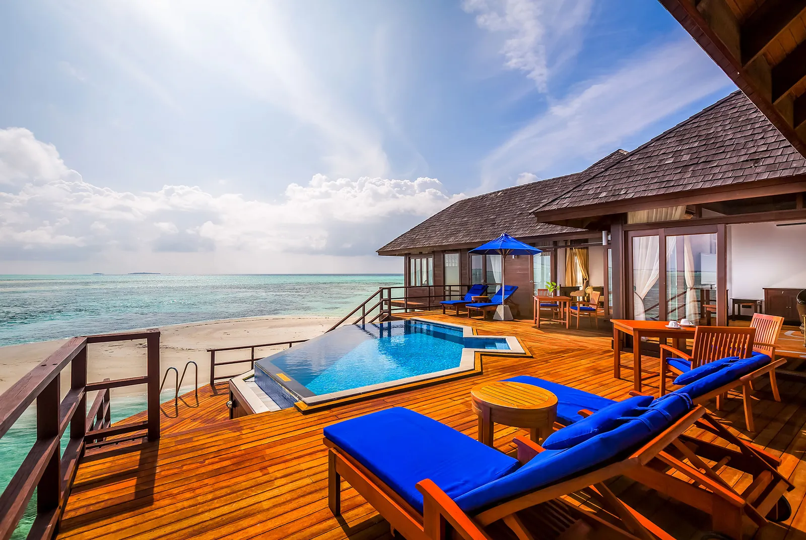 The Presidential Water Suite terrace, its pool and blue loungers over the sea