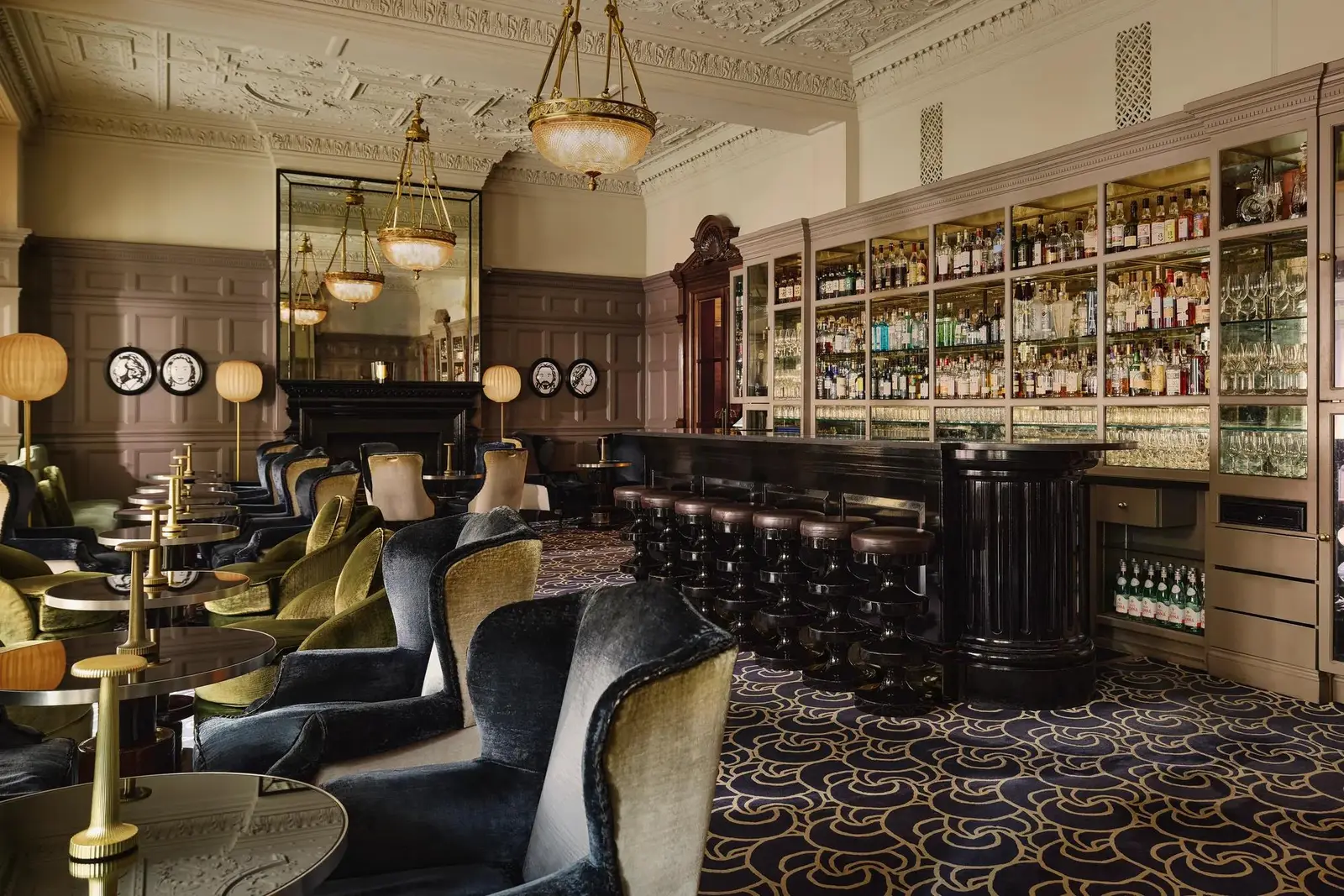 The Coburg Bar: velvet armchairs, a long dark-wood counter and walls of whisky bottles