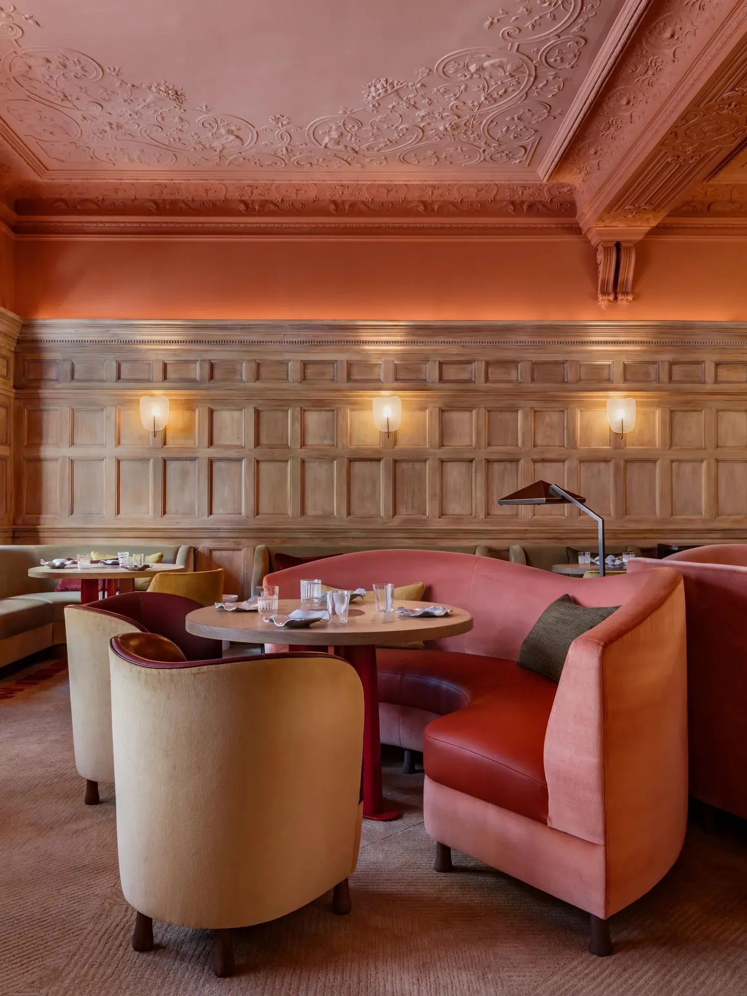 Hélène Darroze’s dining room: panelling, coral velvet banquettes and low lights