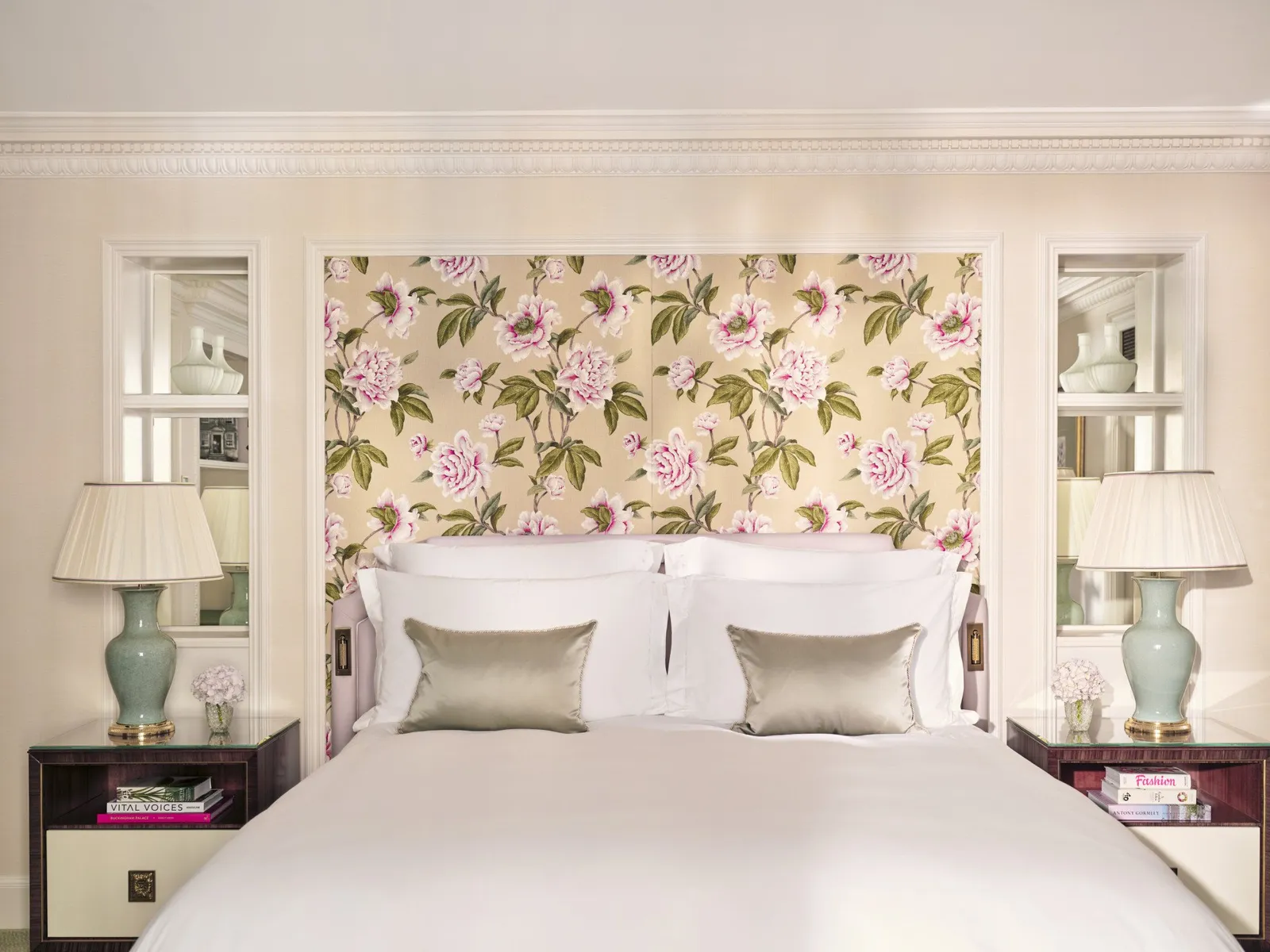Executive Room: the bed beneath its floral headboard