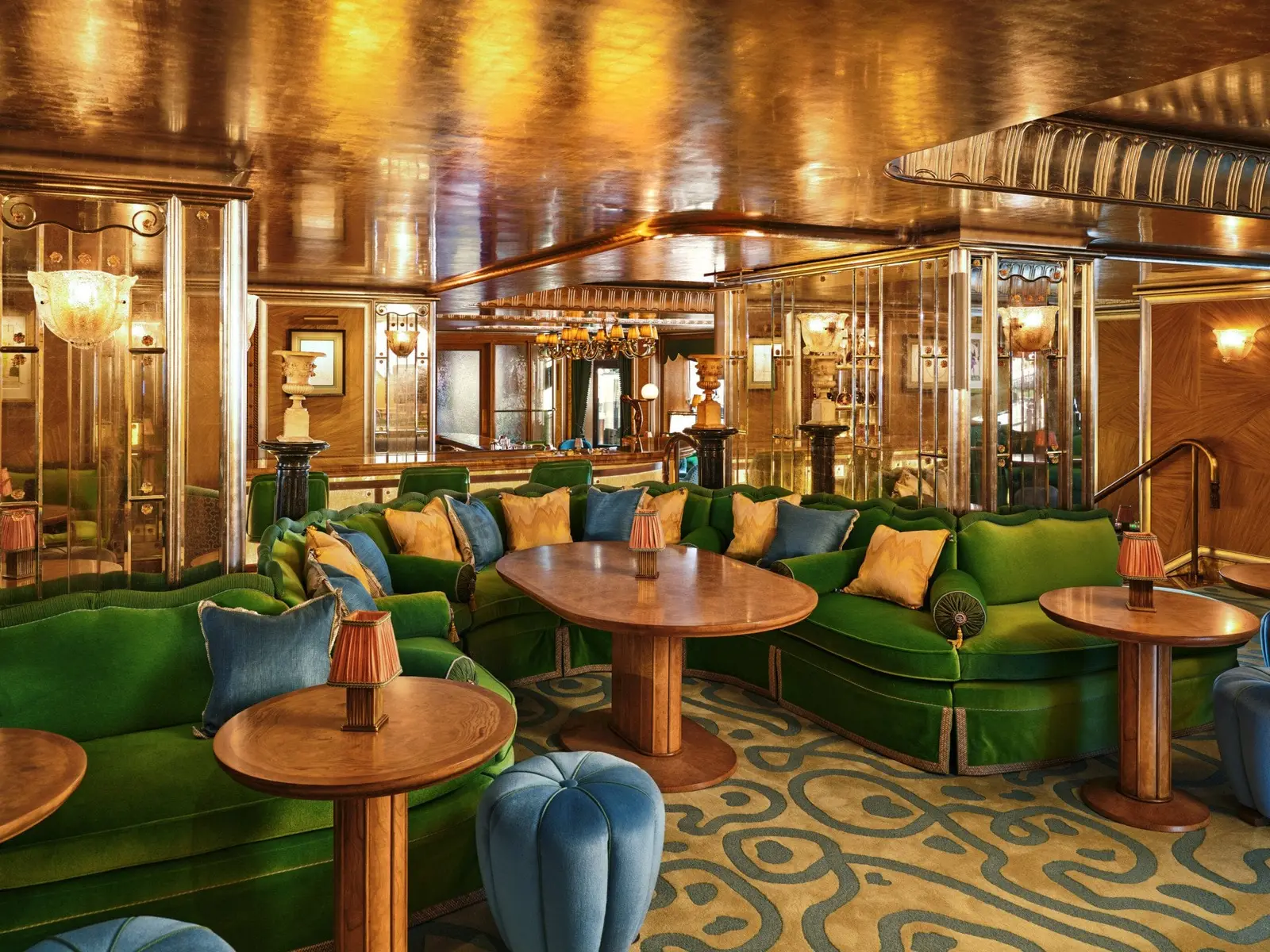 Vesper Bar’s green banquettes and wooden tables