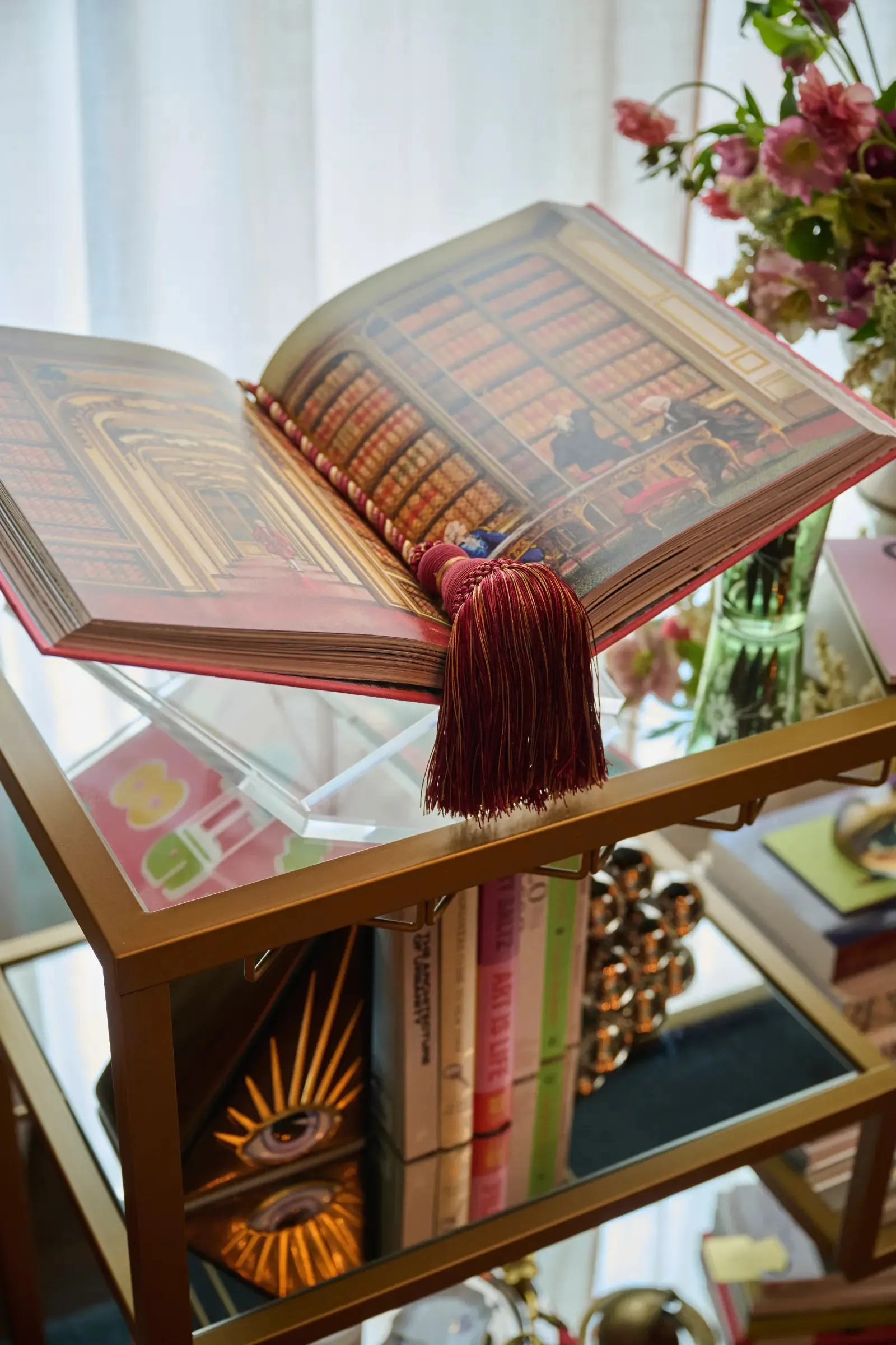 The Book Ritual cart, a gilded volume open on top