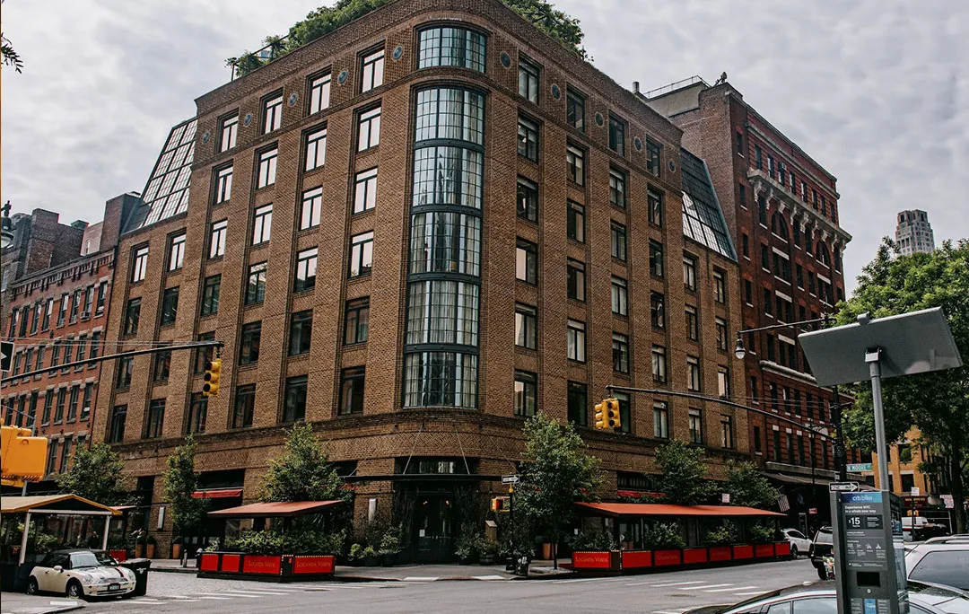 The brick building on the corner of Greenwich Street and North Moore Street