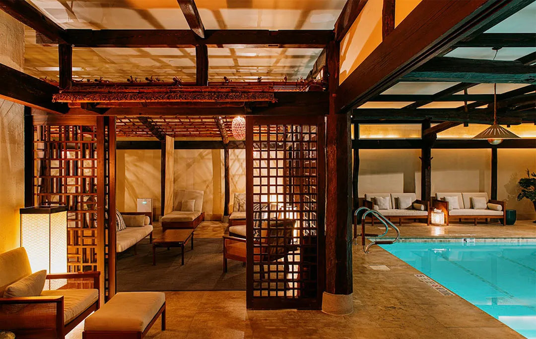 The Japanese farmhouse roof in timber above the pool and loungers