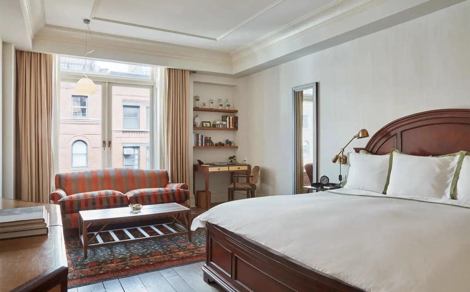 The accessible room with its king bed in the light from the courtyard