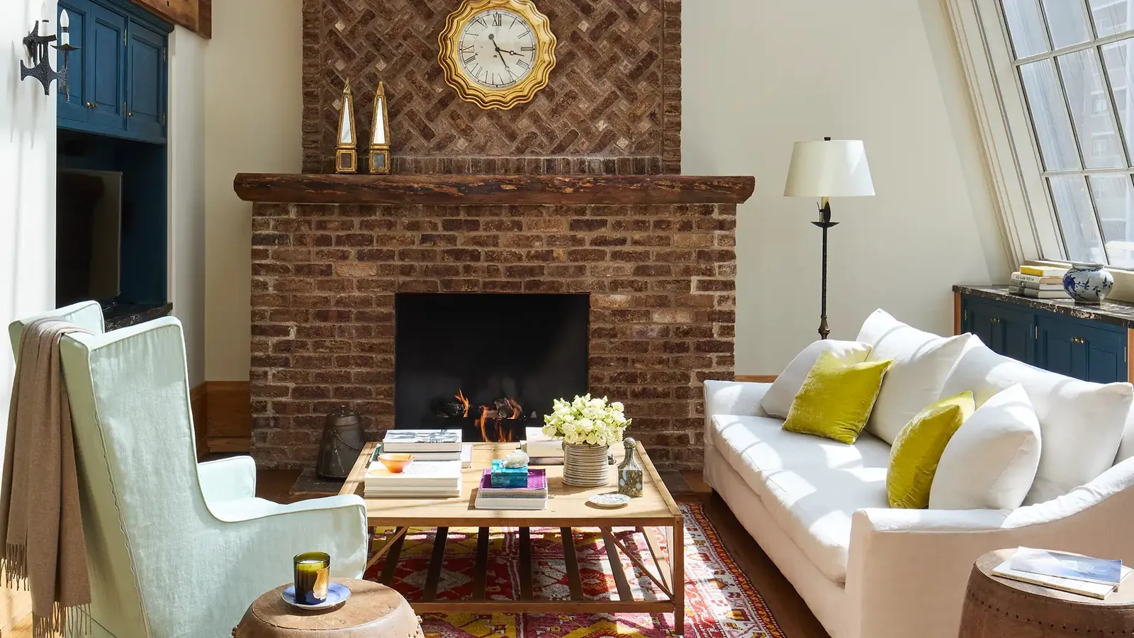 The Greenwich Duplex living room with its fireplace and white sofa