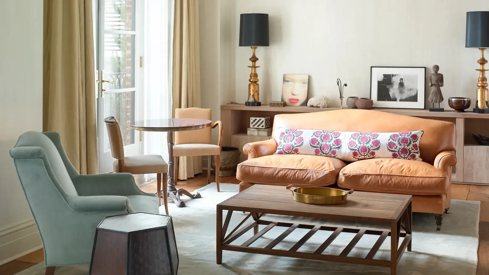 The 2 Bedroom Studio Suite sitting area with an armchair and low table