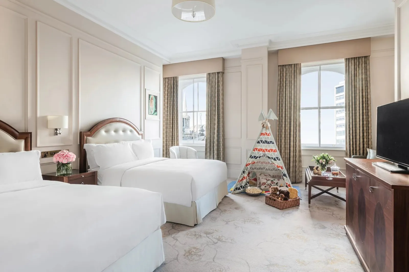 A Family Room: 2 queen beds side by side and a children’s tepee by the window