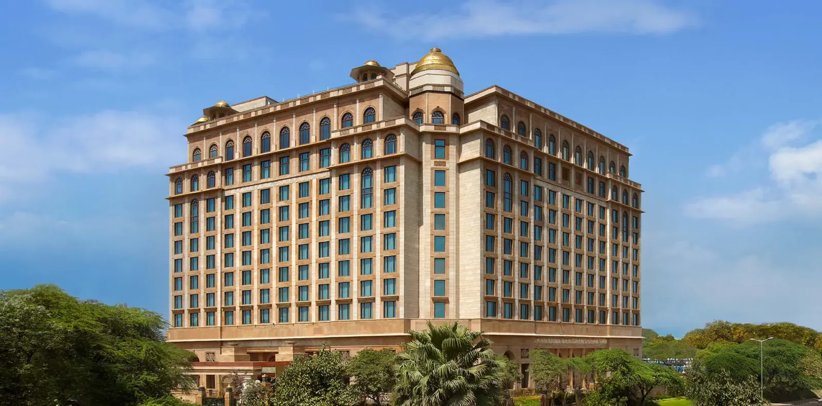 The honey-coloured Leela Palace rising above the trees of Chanakyapuri