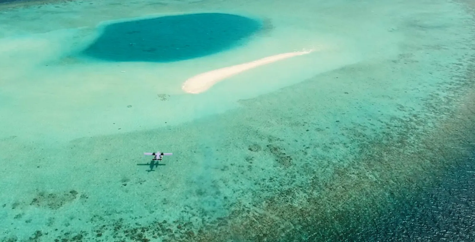 A seaplane above the lagoon.