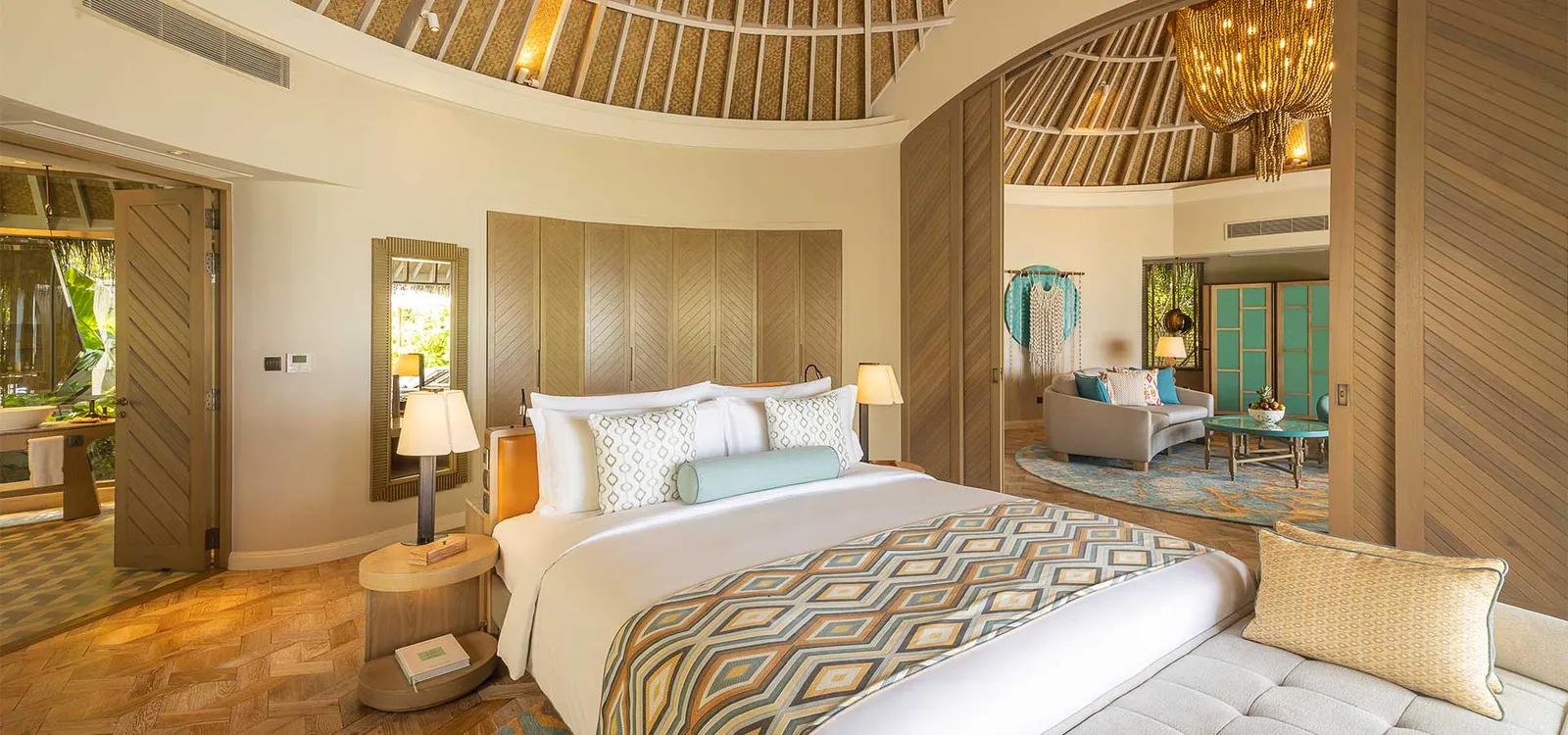 The bedroom with the living area beyond.