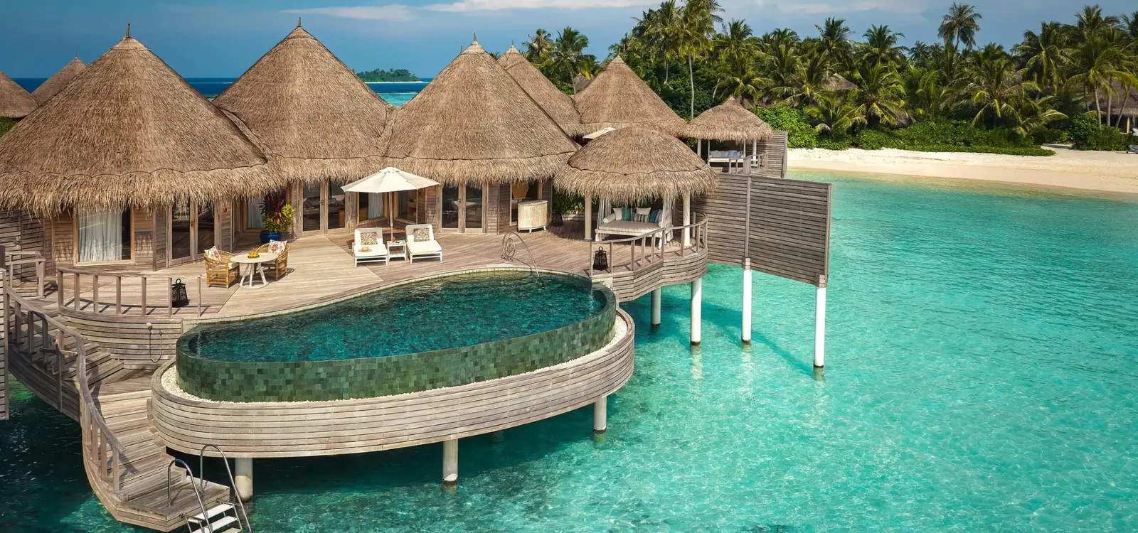 The overwater house with its pool and curved terrace.