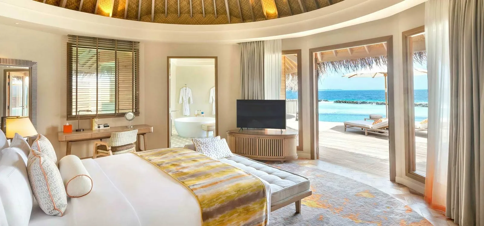 The bedroom with doors opening onto the terrace.