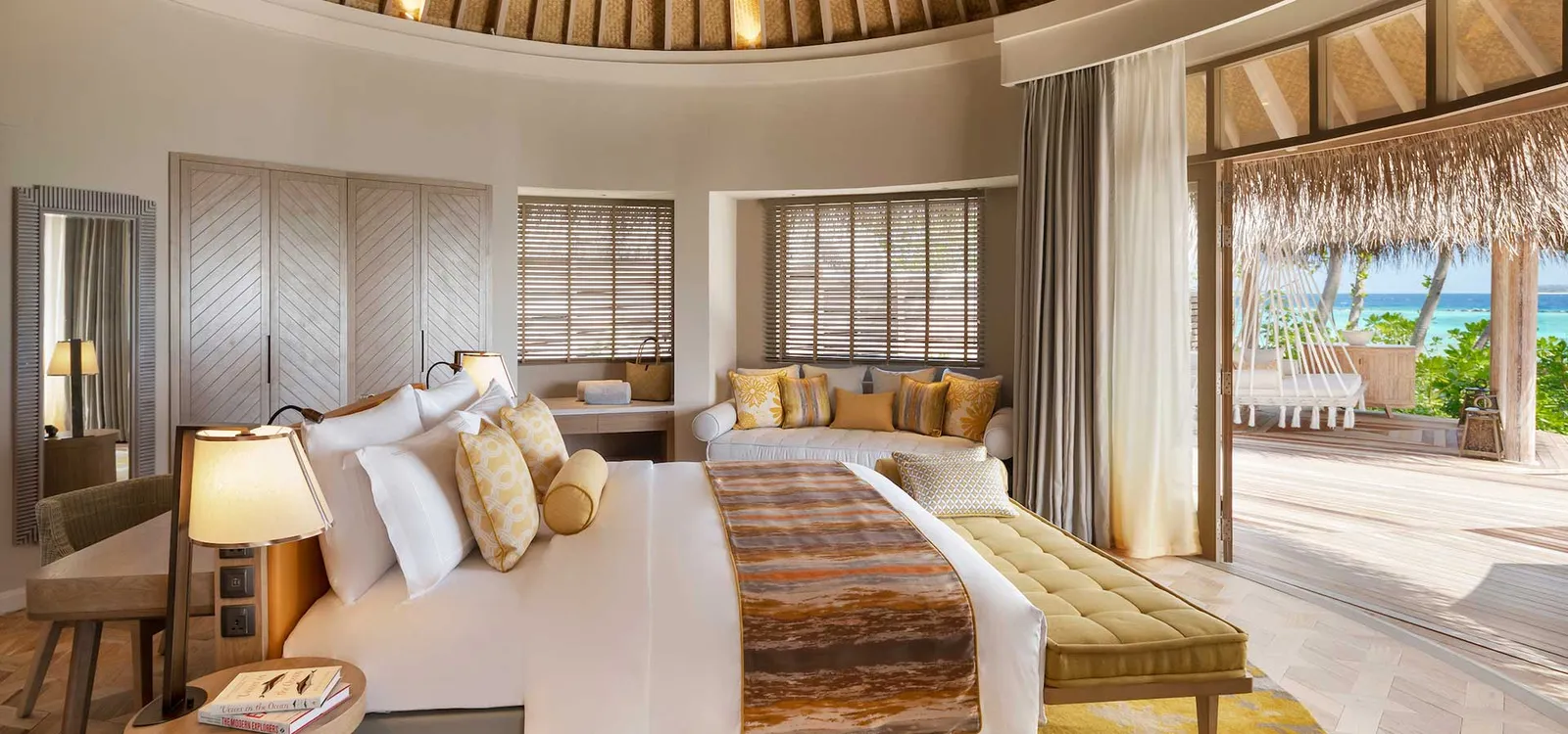 The bedroom with its bed and seating area.