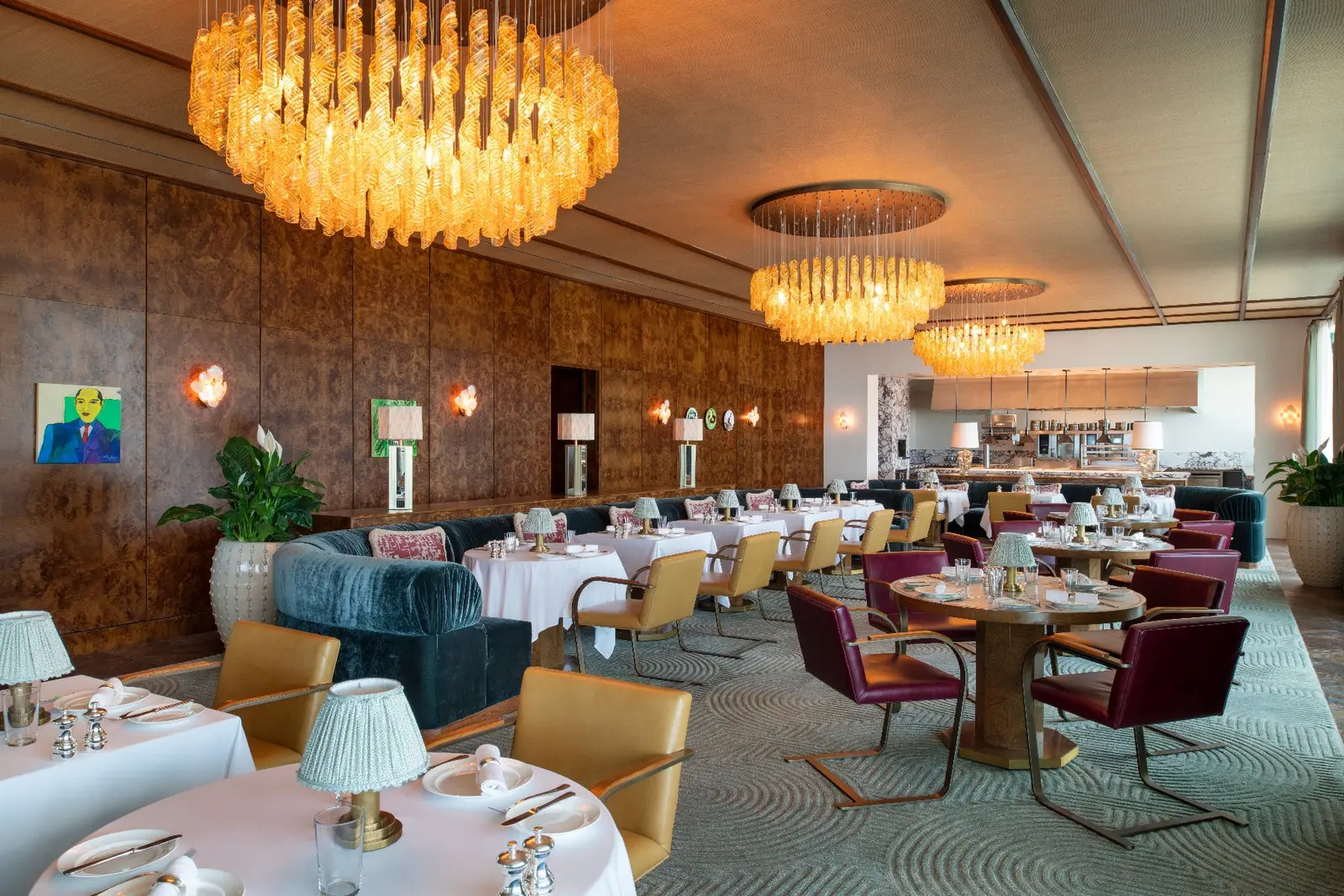 The Ned’s Club Upstairs lounge, green sofas and a round rug
