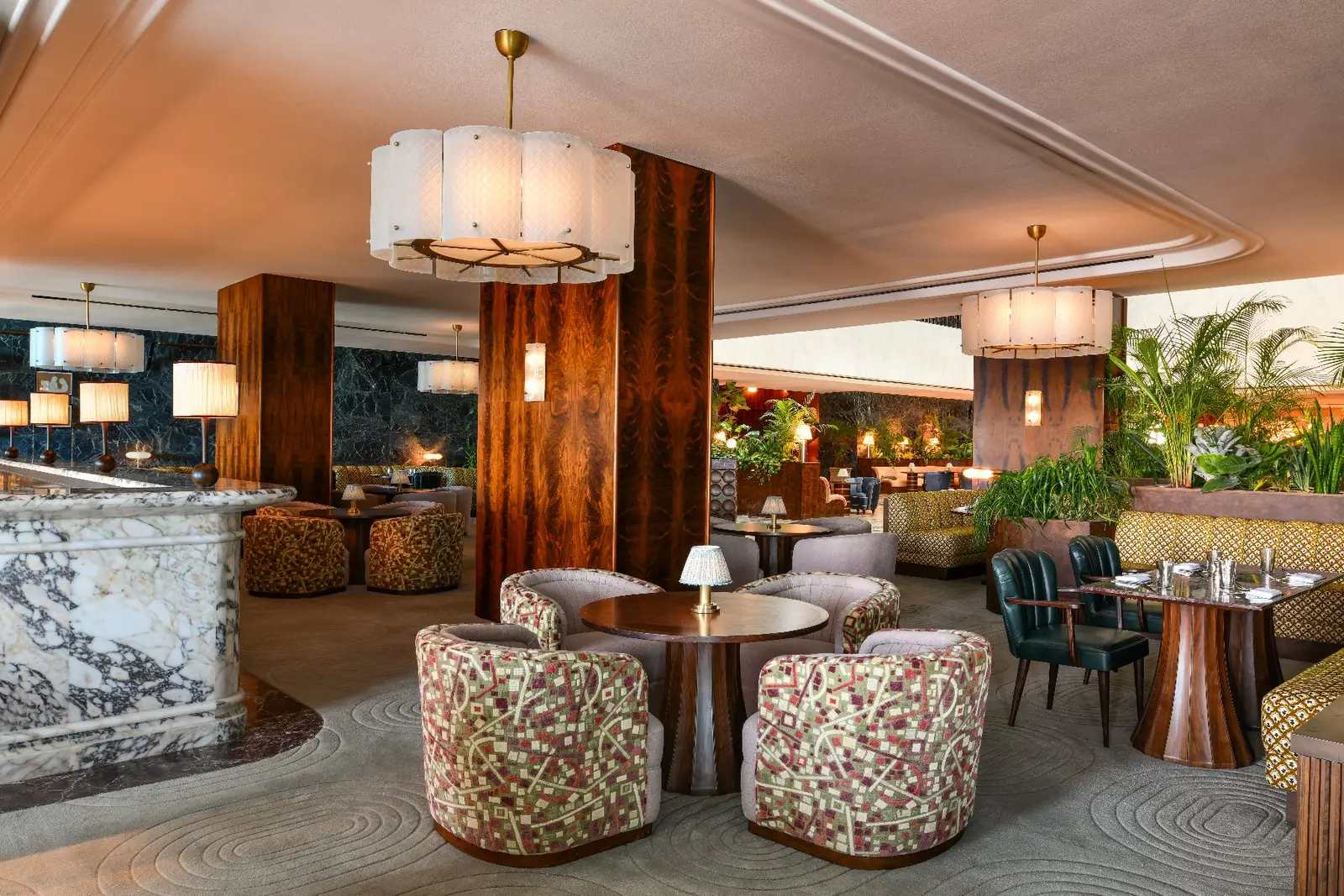 Millie’s Lounge with globe chandeliers and coloured chairs